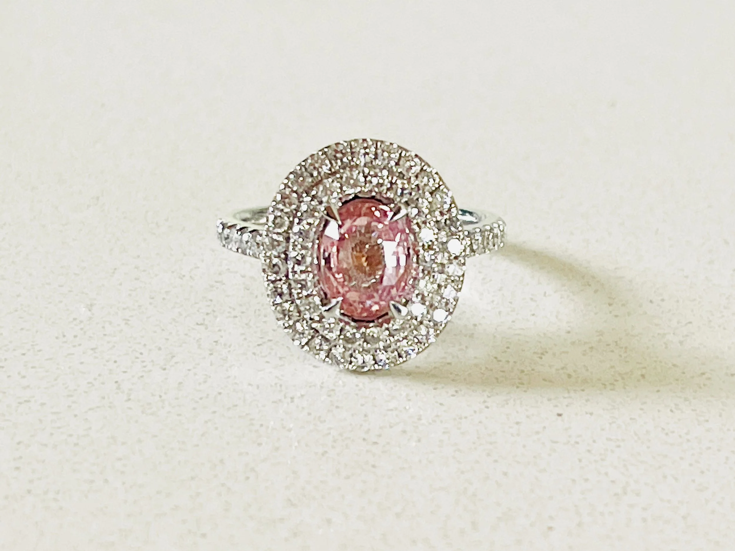 COLLECTABLE PADPARADSCHA SAPPHIRE AND DIAMOND RING WITH VALUATION