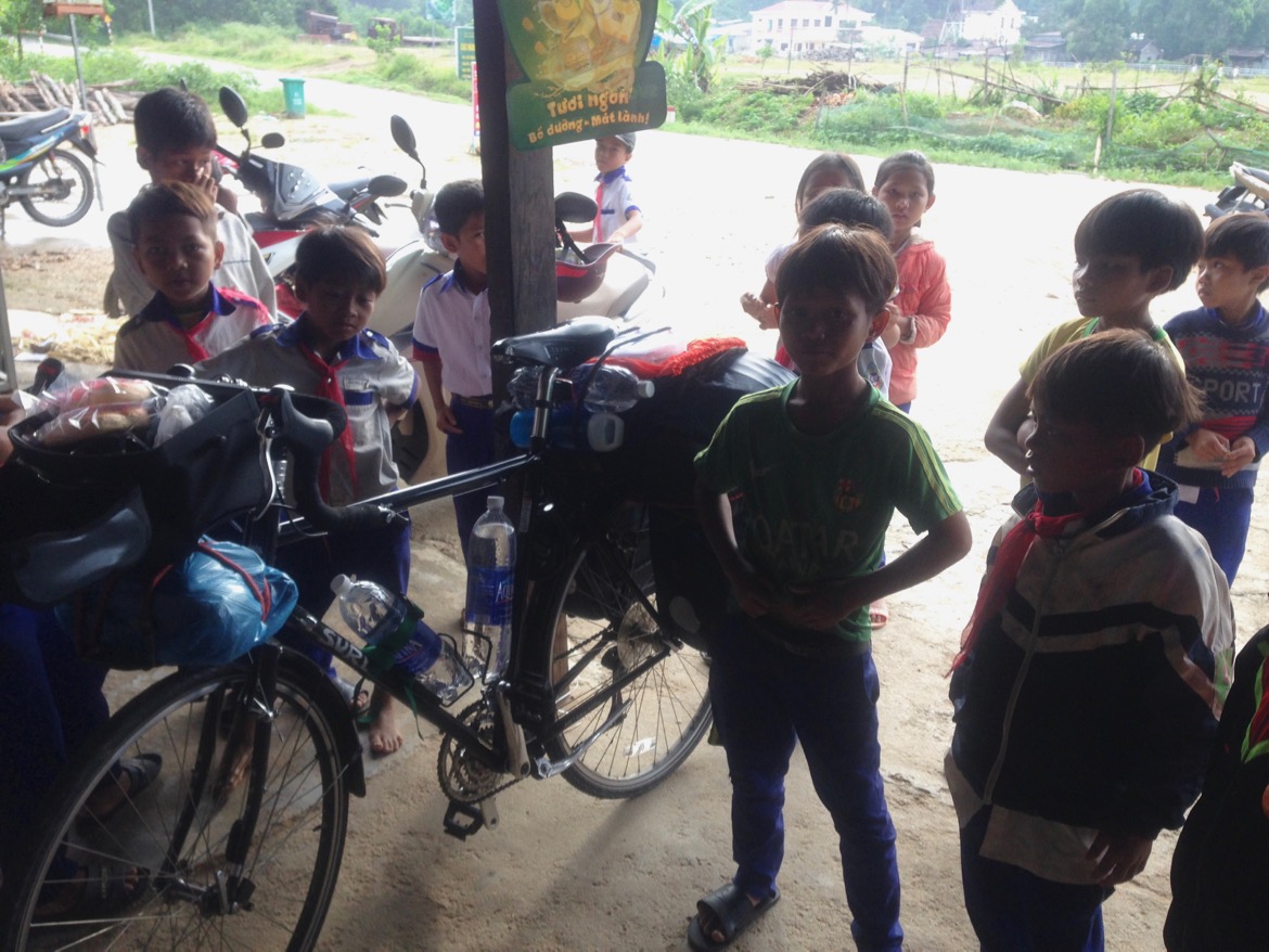  Packing enough water and food before entering the National park. Kids were really interested to check out my packed bike. 