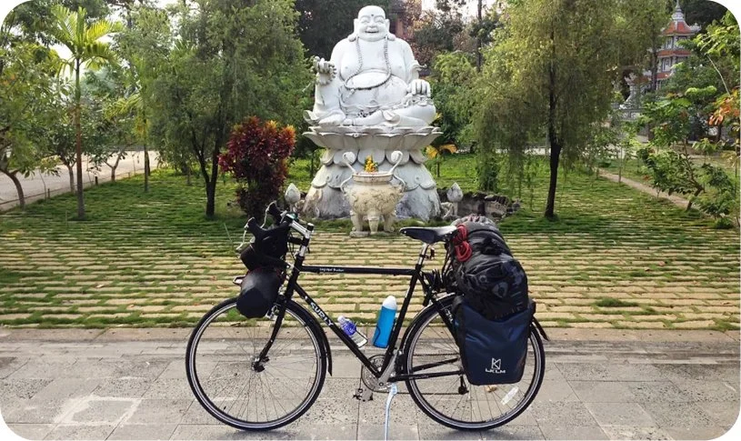Motorcyclist exploring scenic coastal roads, mountain landscapes and local villages in Vietnam