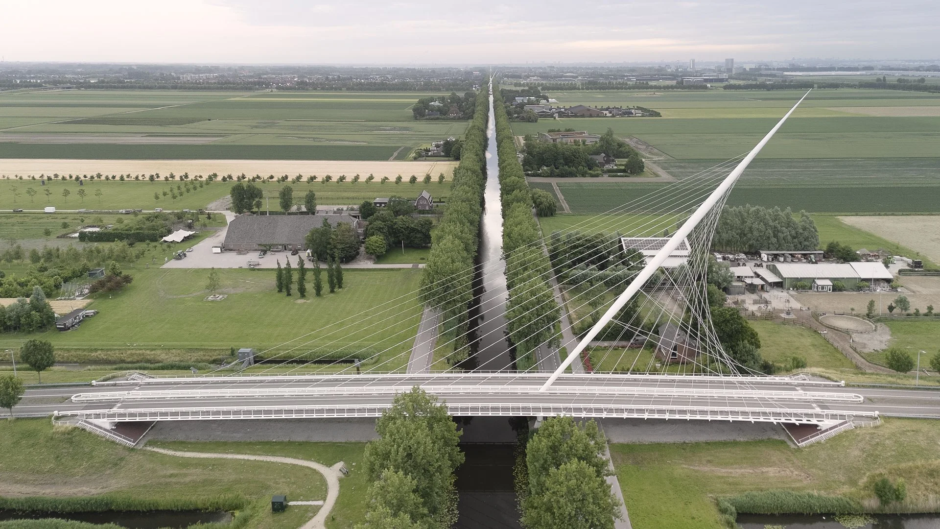 The Santiago Calatrava Harp Bridge over the Hoofdvaart Canal in The Nedtherlands taken from the air. In the distance you can just see the second and third bridges of the series by Calatrava.