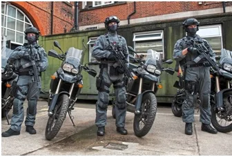 Kevlar-clad CTSFOs stand beside their new fast response motorcycles in this 2016 publicity shoot (London Evening Standard)