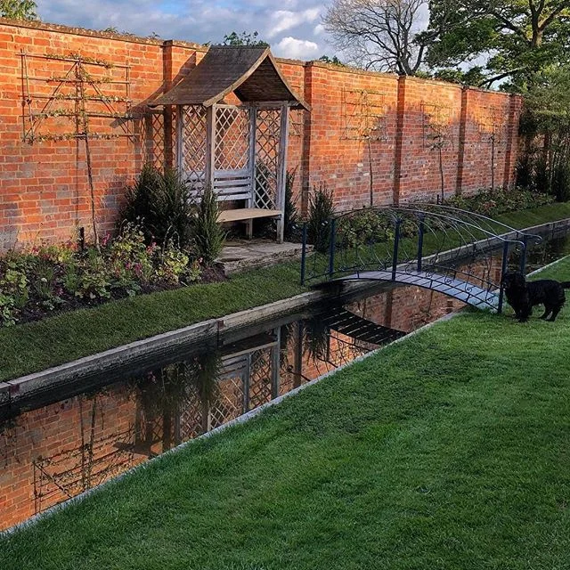 So pleased to see this new planting and concept at @admingtonhall establishing well. What was a rough bank now transformed into a more formal garden space. Concept developed in collaboration with the lovely owners. The early foil of #tellima and #dic