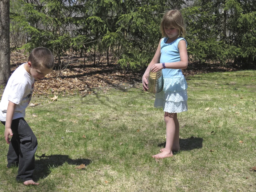 My Grandkids spreading a mix of White Millet and Cracked Corn