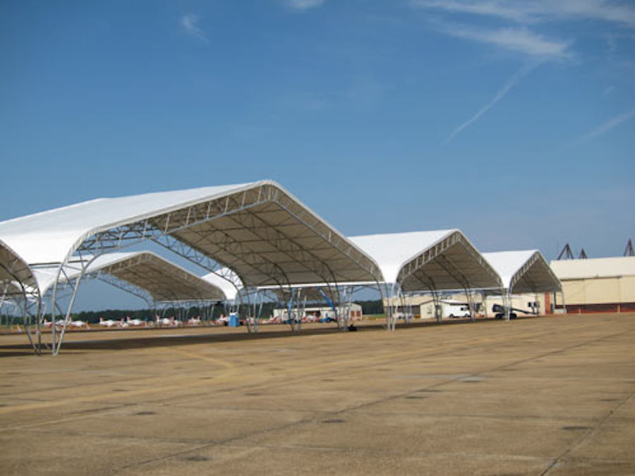  This design was a first for Shelter Structures, a triple wide shelter designed to maximize tarmac space for NAS Meridian. After successful completion of the project in 2006, Shelter Structures was invited back and challenged to provide cover for 54 