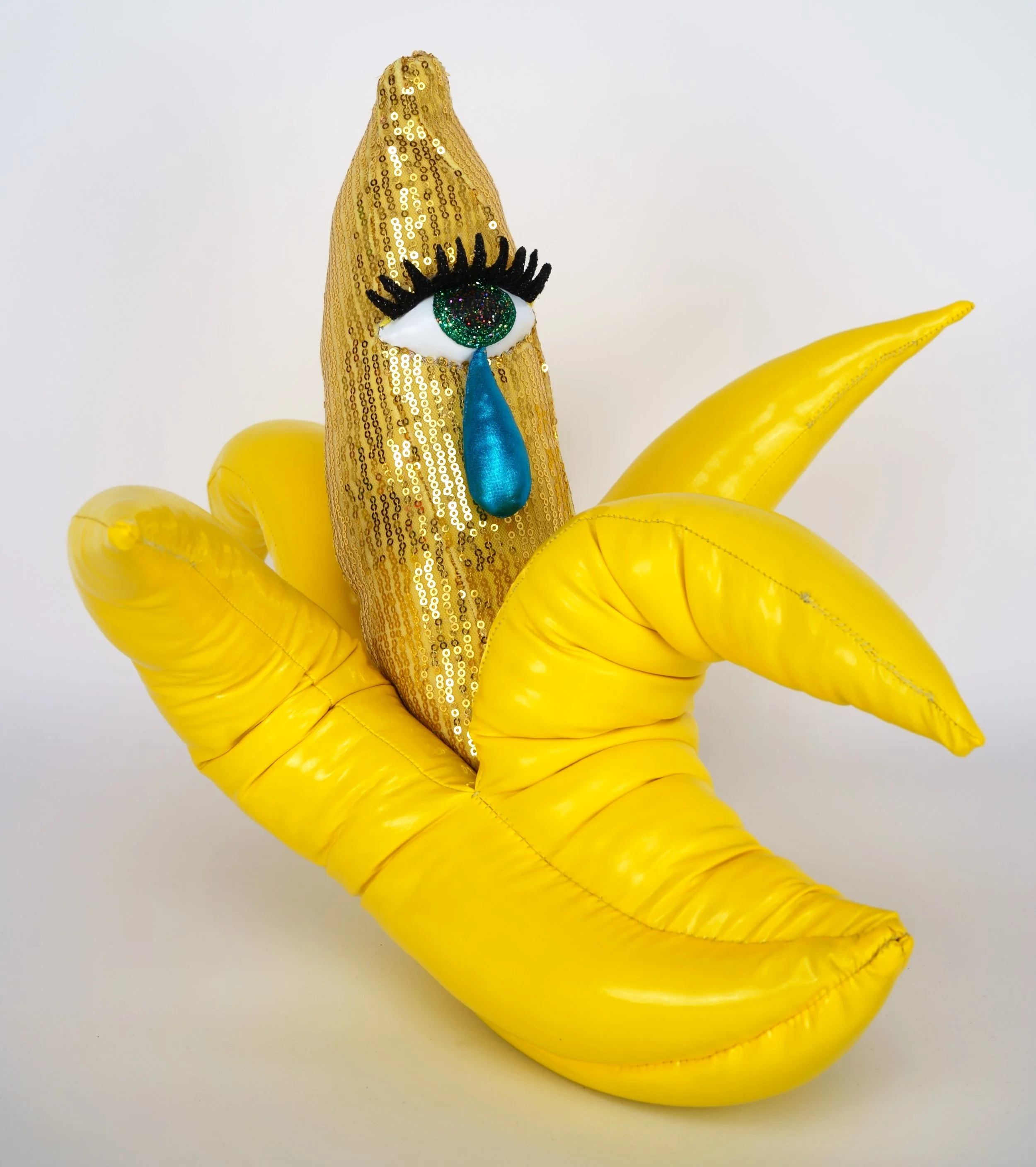 Hein Koh, Weeping Banana , 2018, acrylic, felt, fiberfill, glitter, metallic spandex, sand, sequined spandex, string, vinyl, wire, 14 x 16 x 18 inches