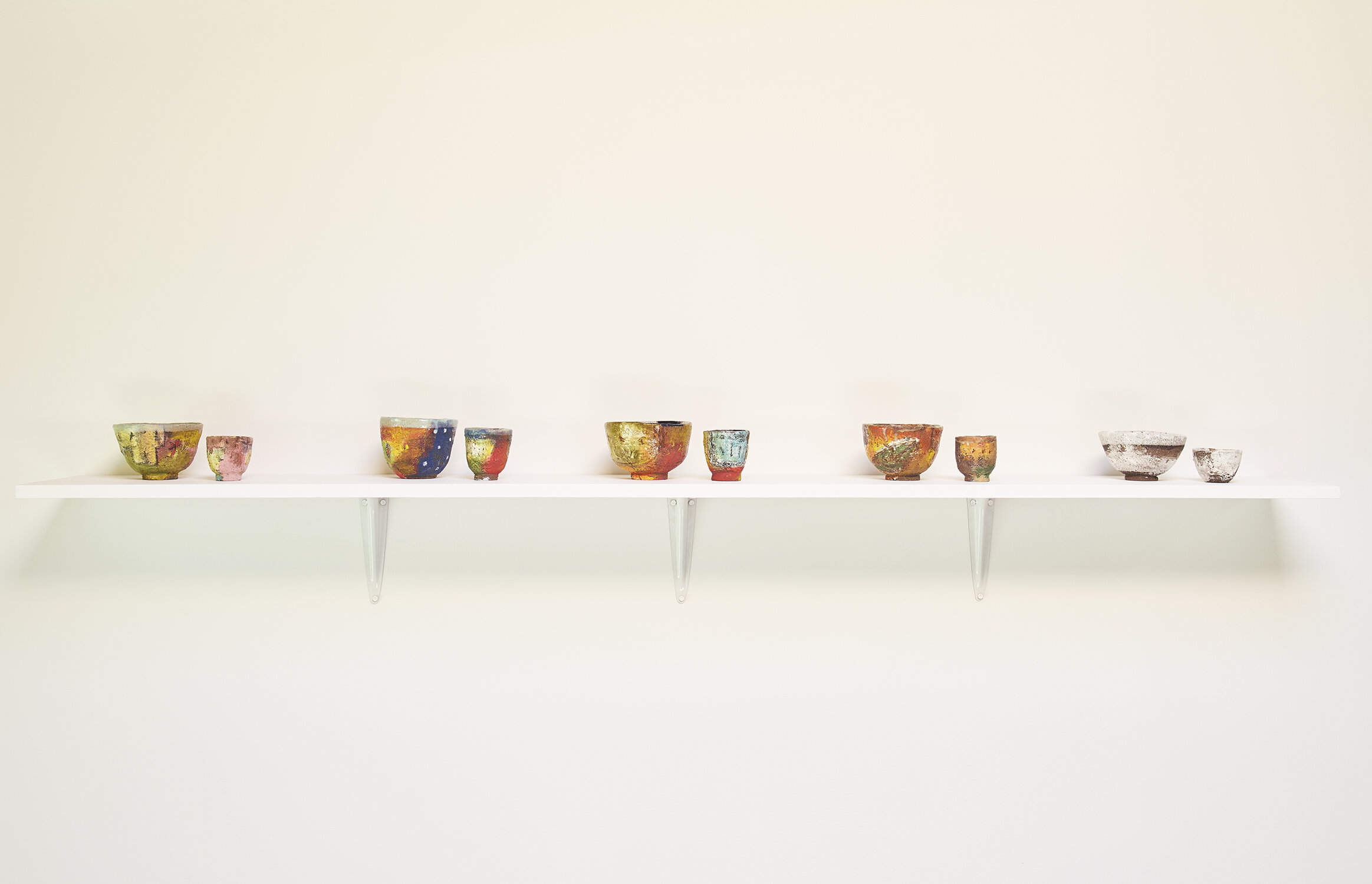 Shino Takeda From left: Spring, Summer, Indian Summer, Autumn, Winter , all 2019 Traditional Japanese tea bowl and sake cup sets ceramic, slip, underglaze, glaze Tea bowls all approximately 3 ¼ × 5 ¼ × 5 inches (8.26 × 13.34 × 12.70 cm) Sake cups all approximately 2 ⅝ × 2 ½ × 2 ⅞ inches (6.67 × 6.35 × 7.30 cm)