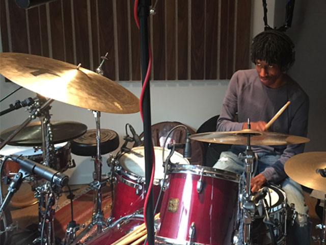 student playing drums