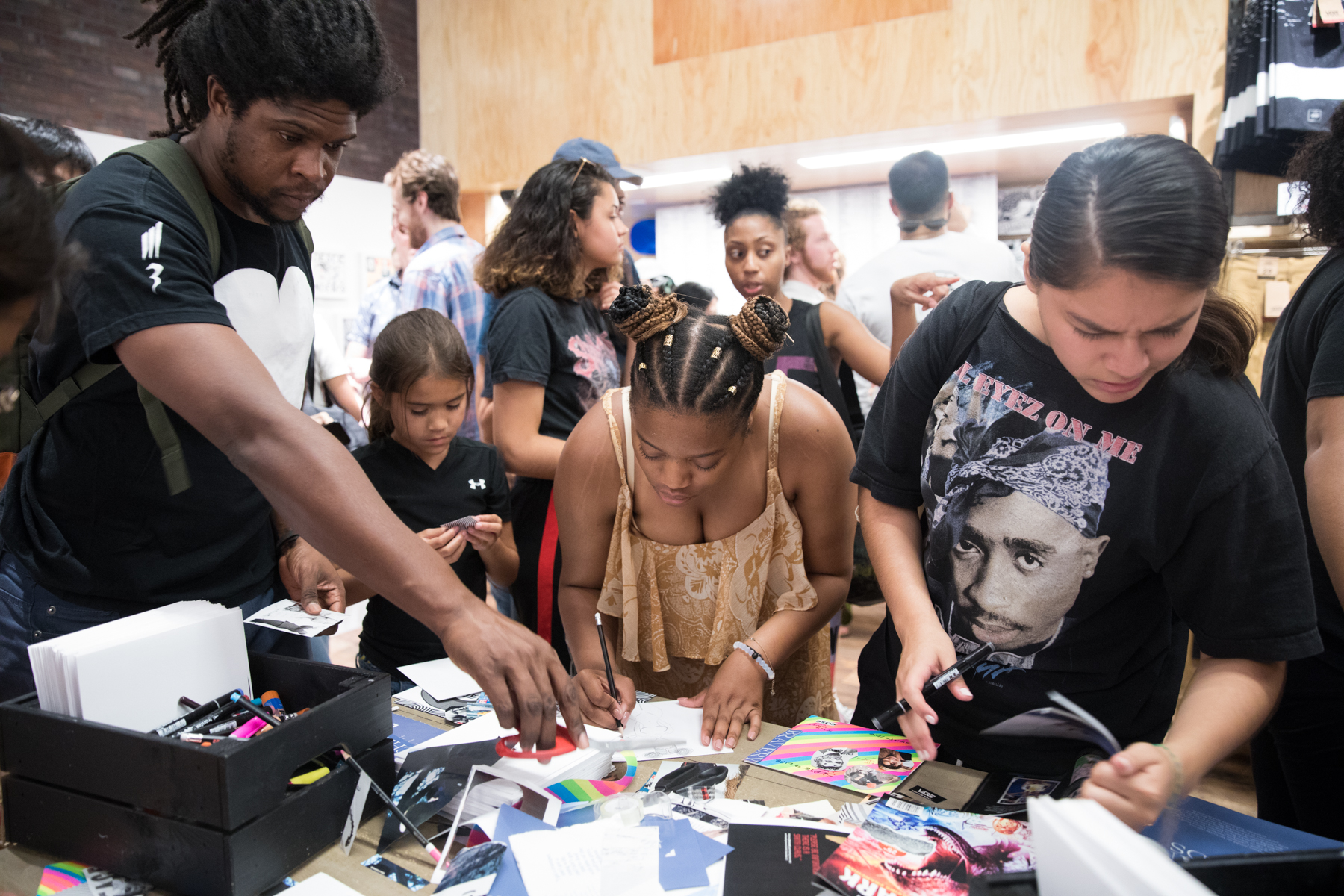 people looking at artwork