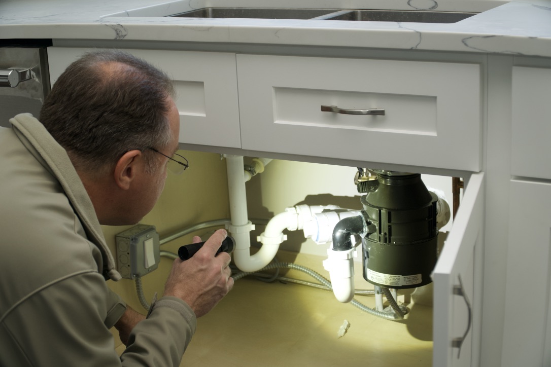 I do a visual inspection of viewable plumbing, checking for leaks past or present.