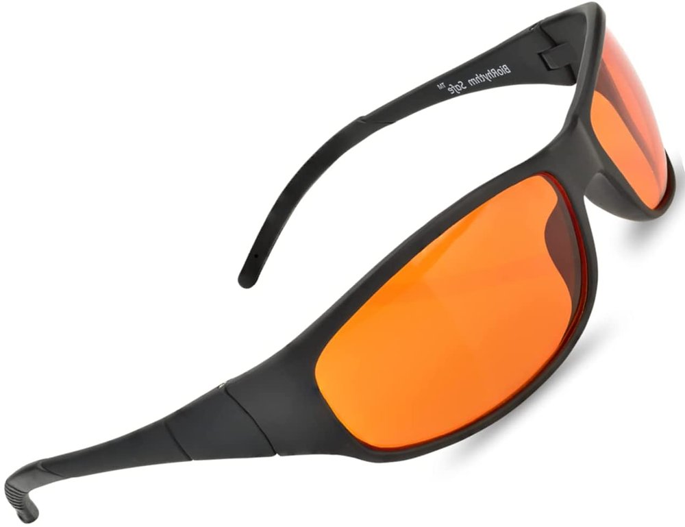 Blue light blocking glasses—orange lenses. Black plastic wraparound frames, bright orange lenses.