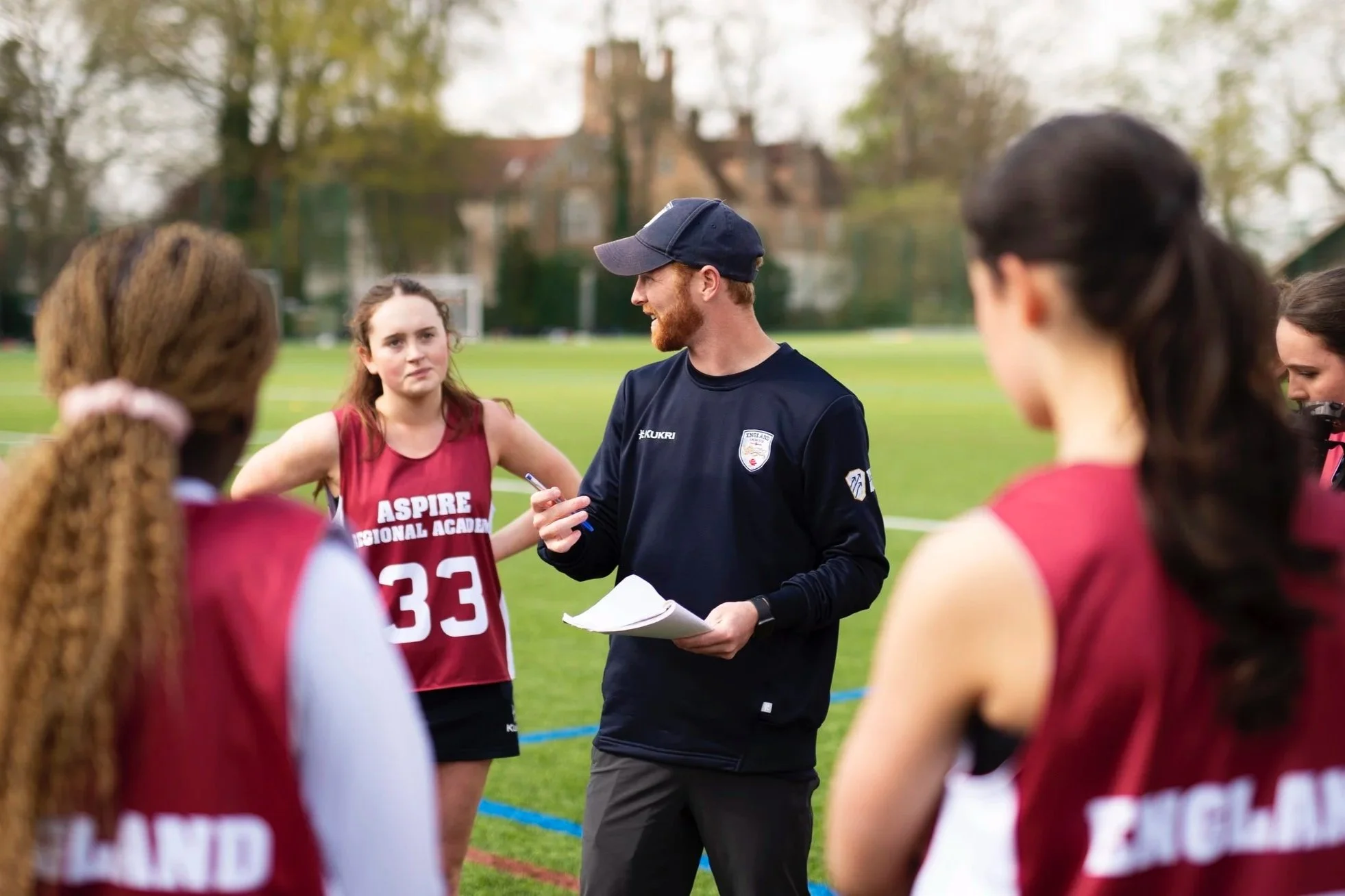 Coach speaks to players