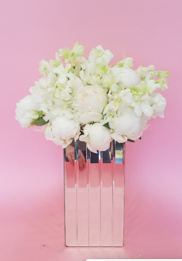white-arrangement-pink-background.png