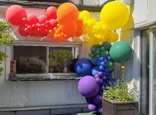 rainbow-balloon-arch-storefront.jpg