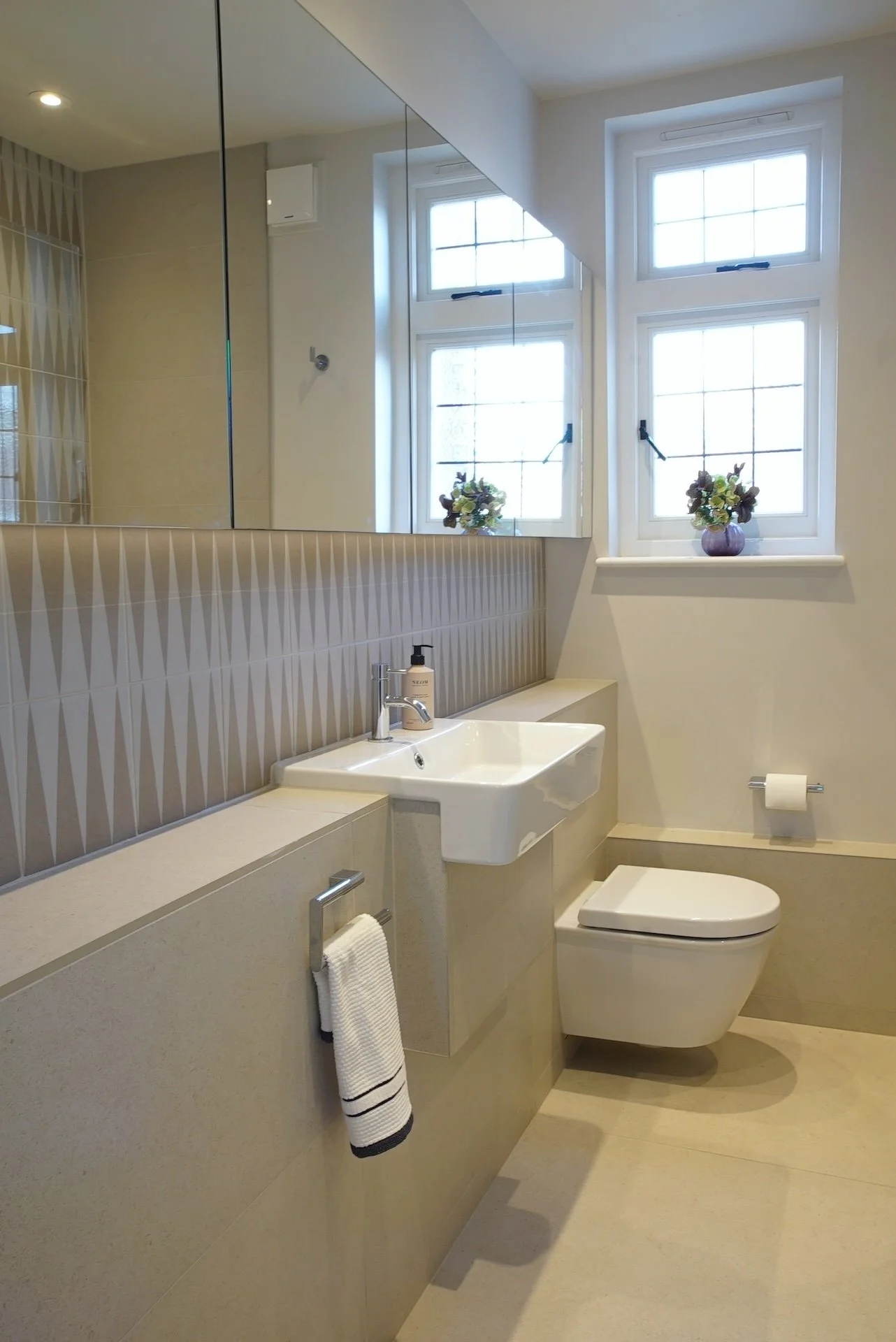 neutral tiles bathroom mirrored cabinet.JPG