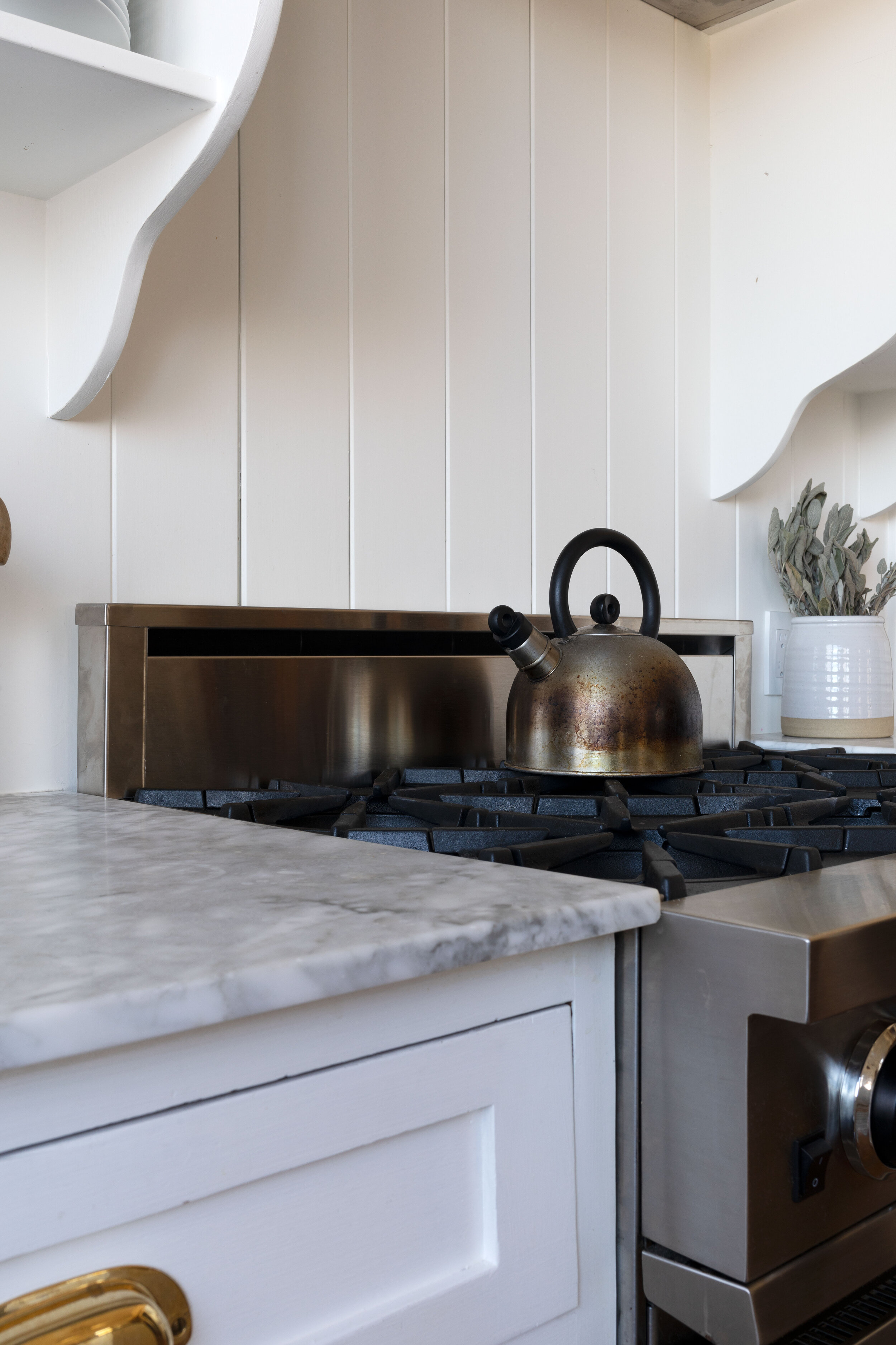 Why We Added a Backsplash To our Range (+ How the Paneling is Holding Up) —  The Grit and Polish
