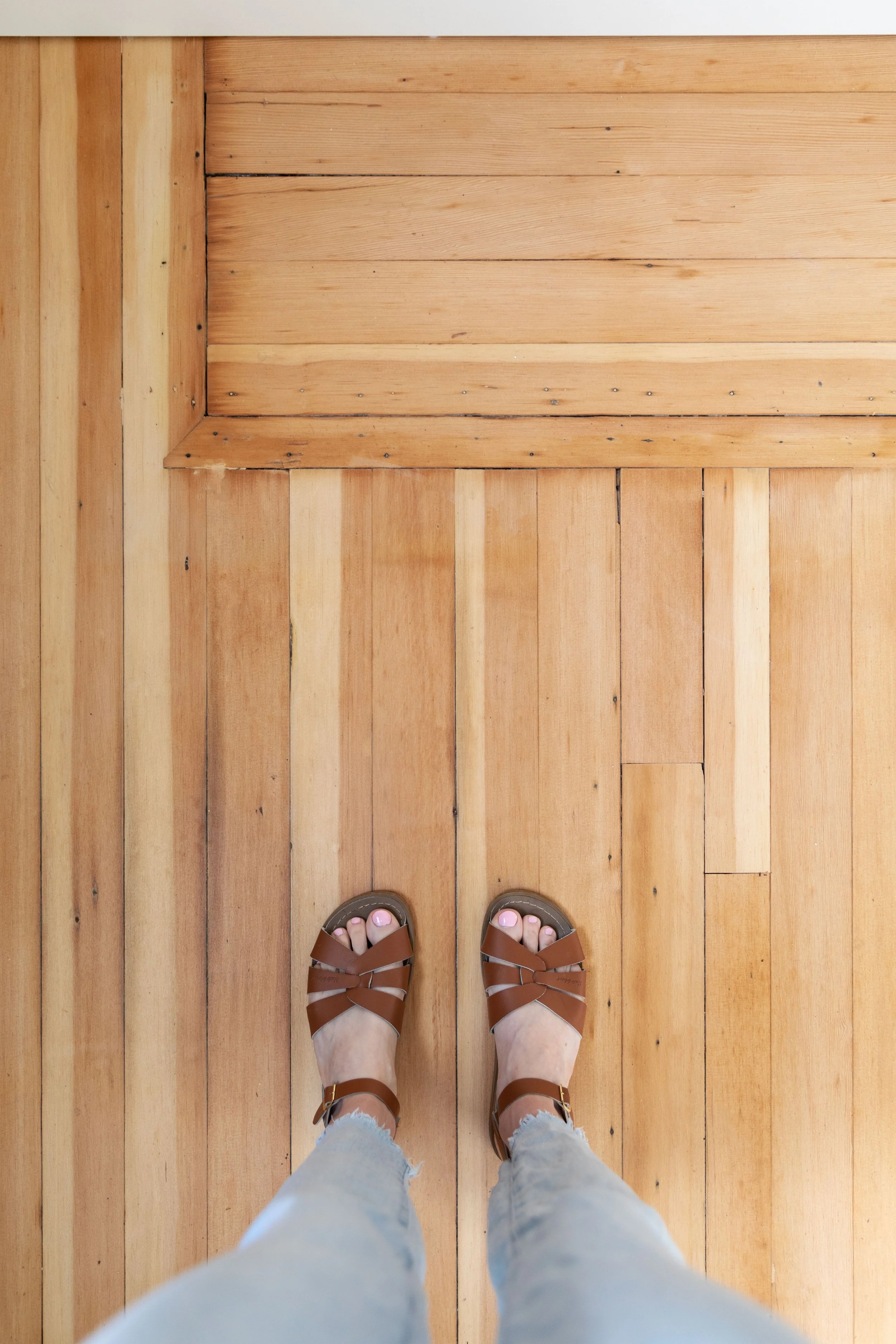 Original fir floors refinished with large patch that adds character to 100 year old floors.