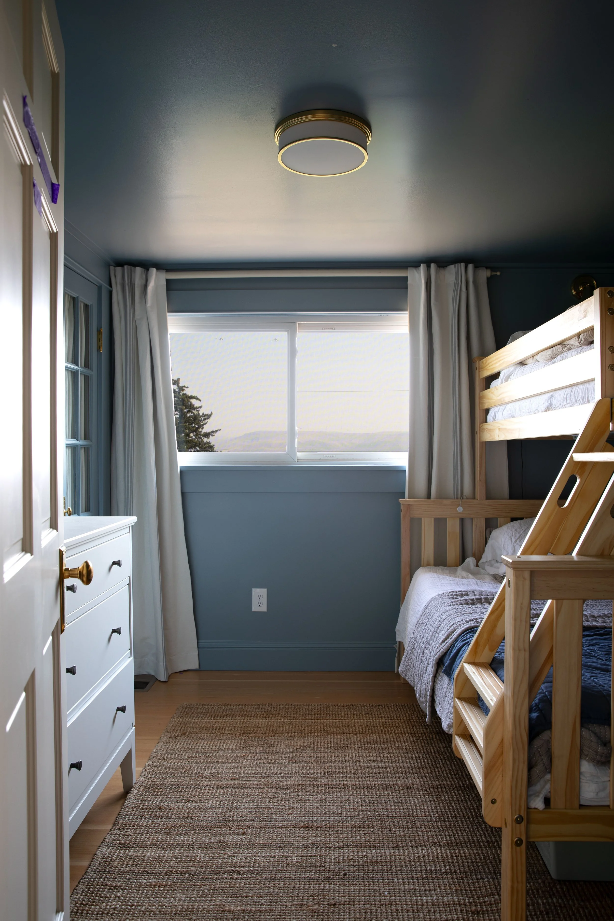 The boys bunk room in the Hill house with 7' ceilings and color drenched in SW debonair