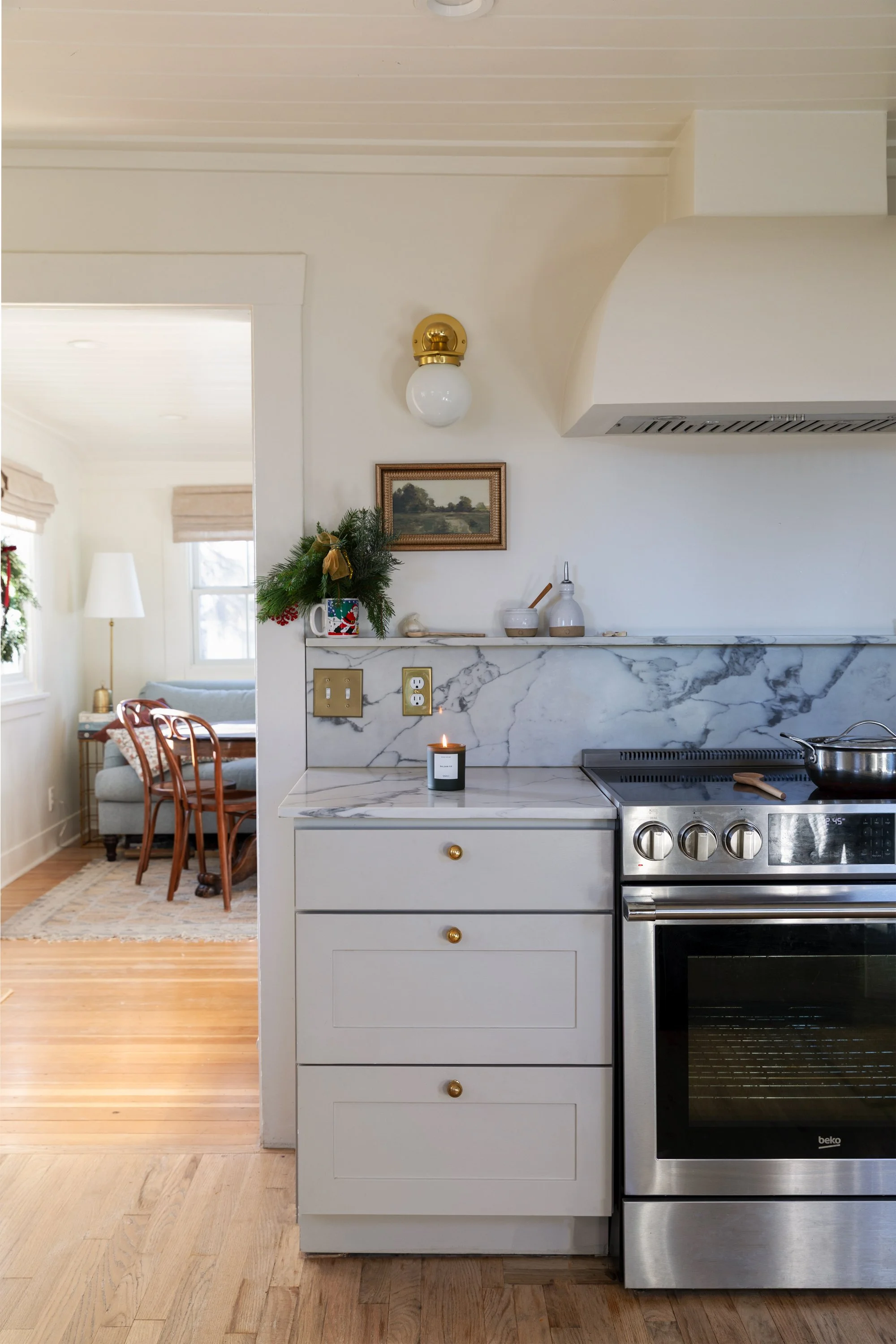 Poplar Cottage kitchen decorated for Christmas with candle and greenery