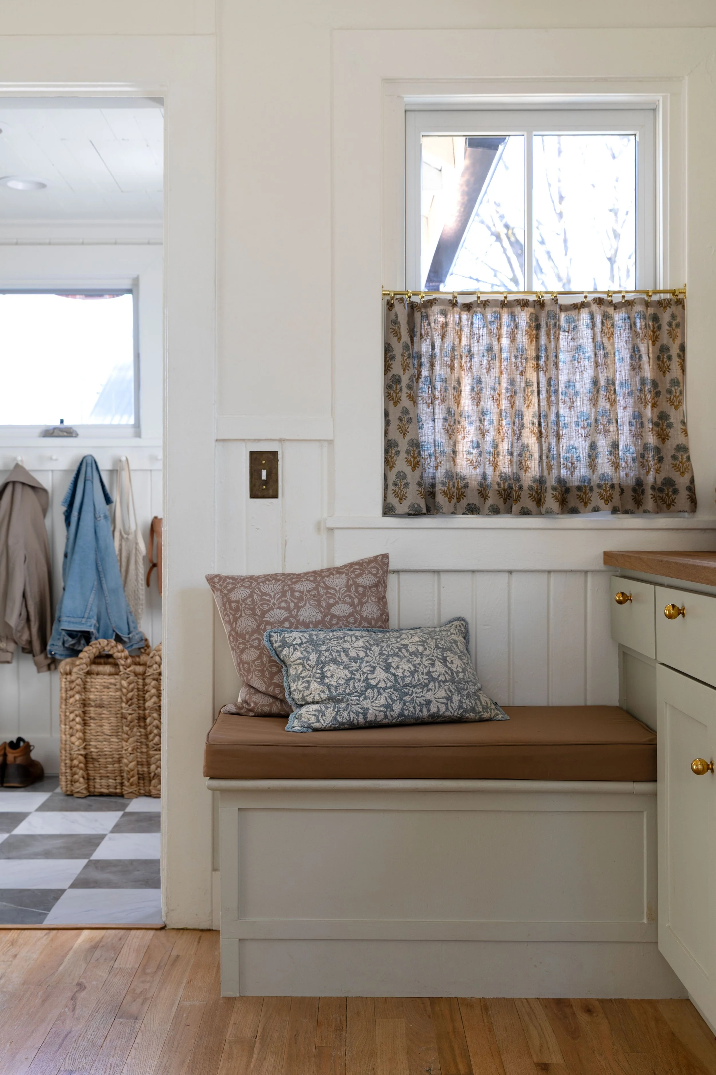 Built-in bench with Amazon cushions and linen café curtains.