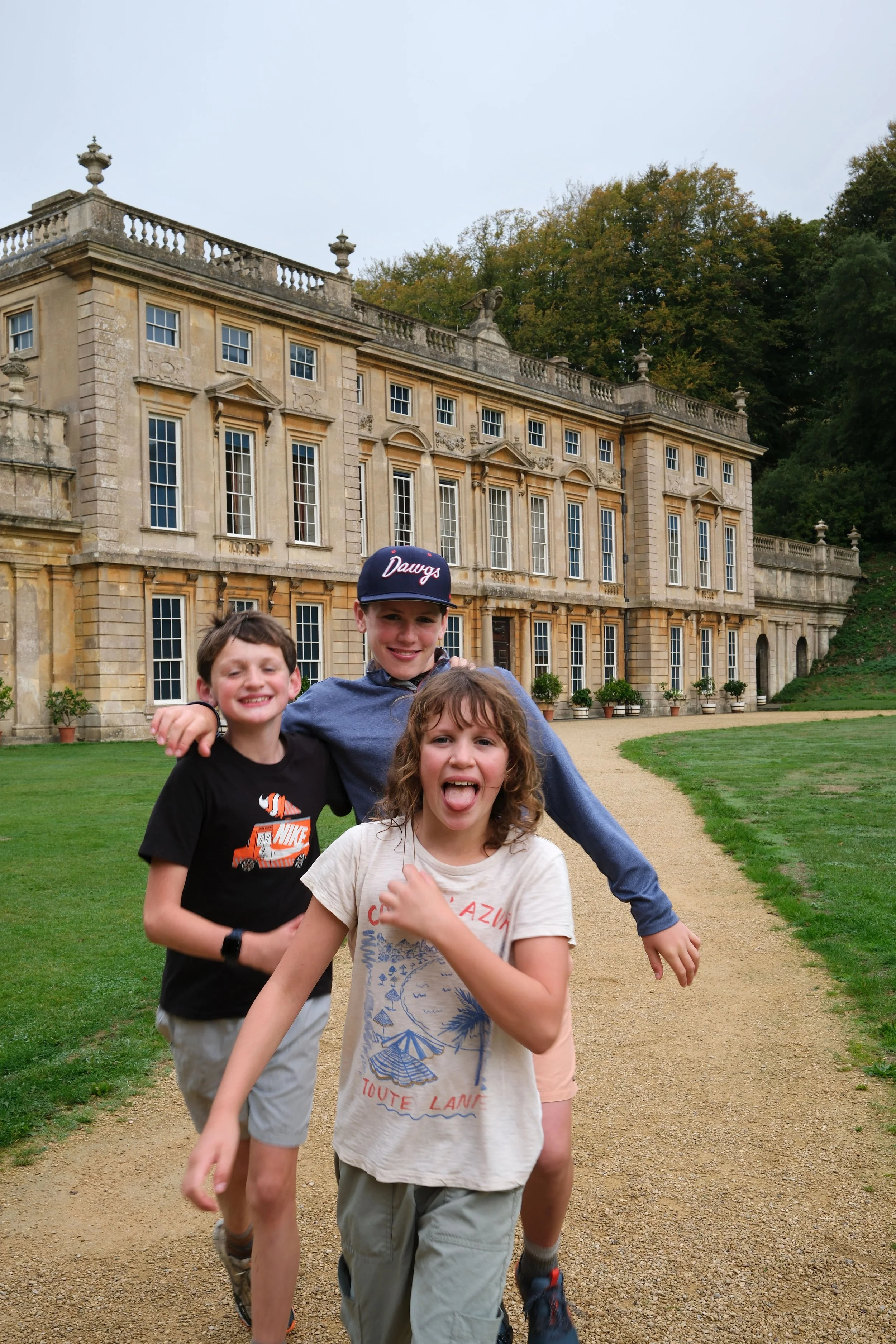 Kids walking the Cotswold Way trail near Dyrham England