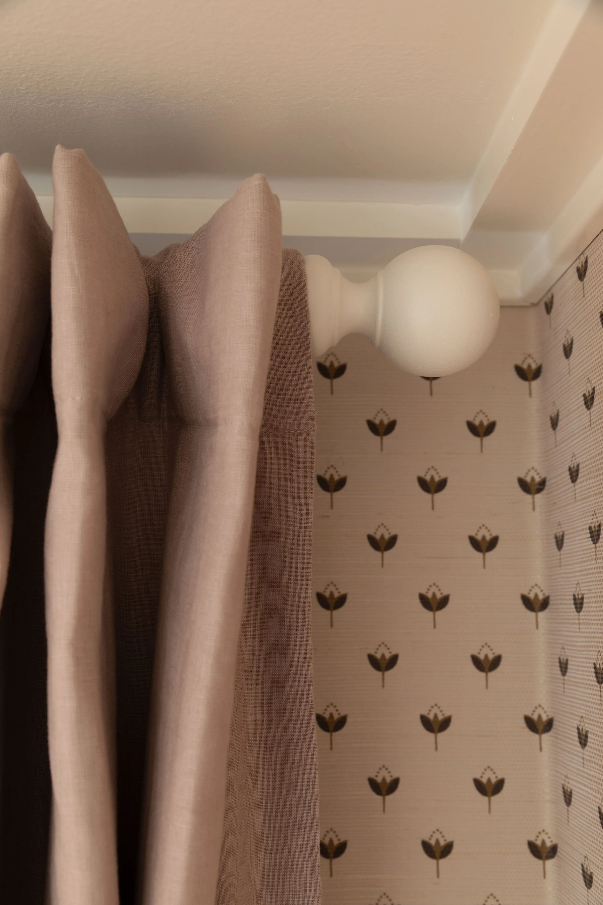 DIY wood curtain rods using a Home Depot rod and these unfinished ball knobs