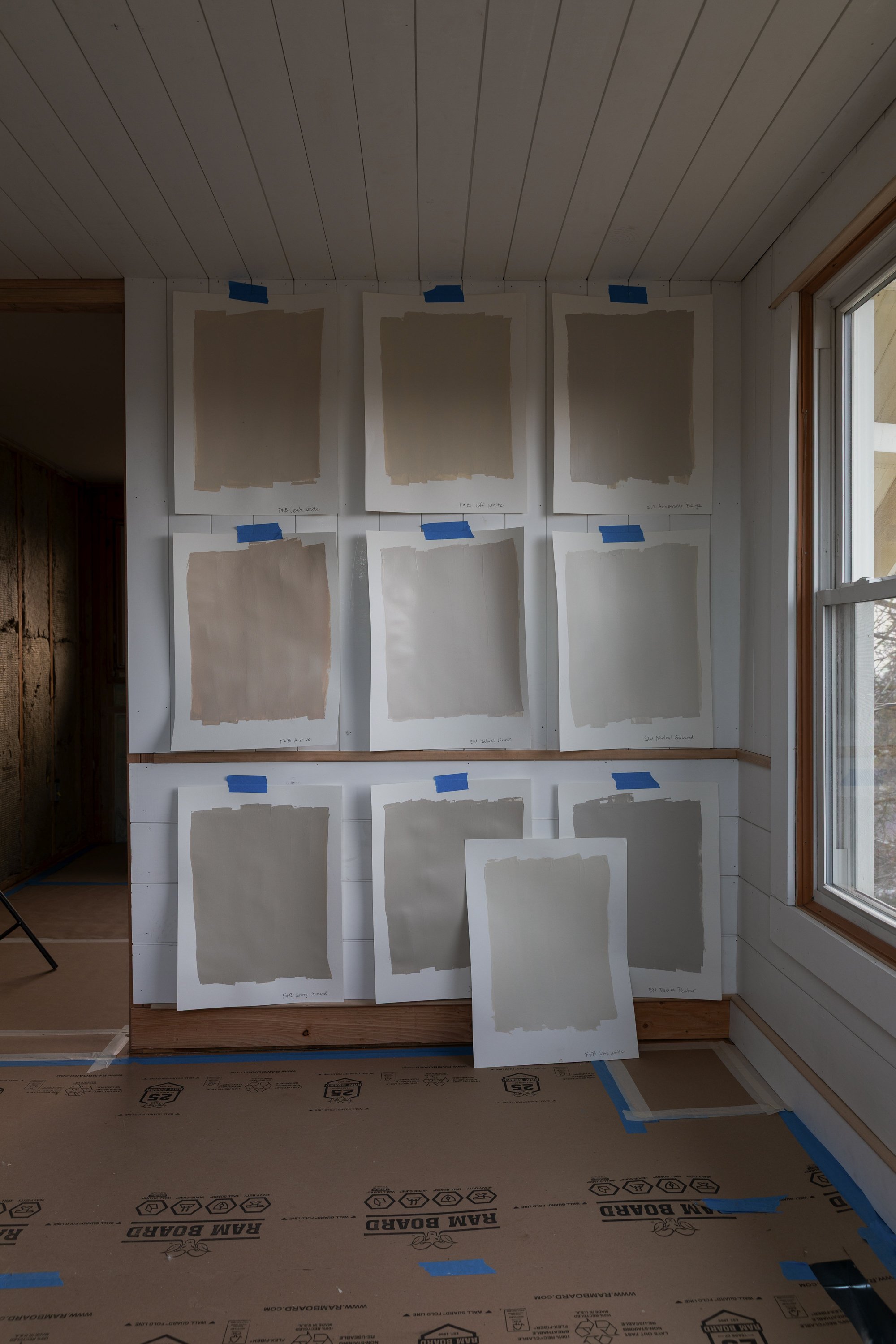 Neutral paint colors on planked walls photographed in cool winter light to show gray and warm undertones