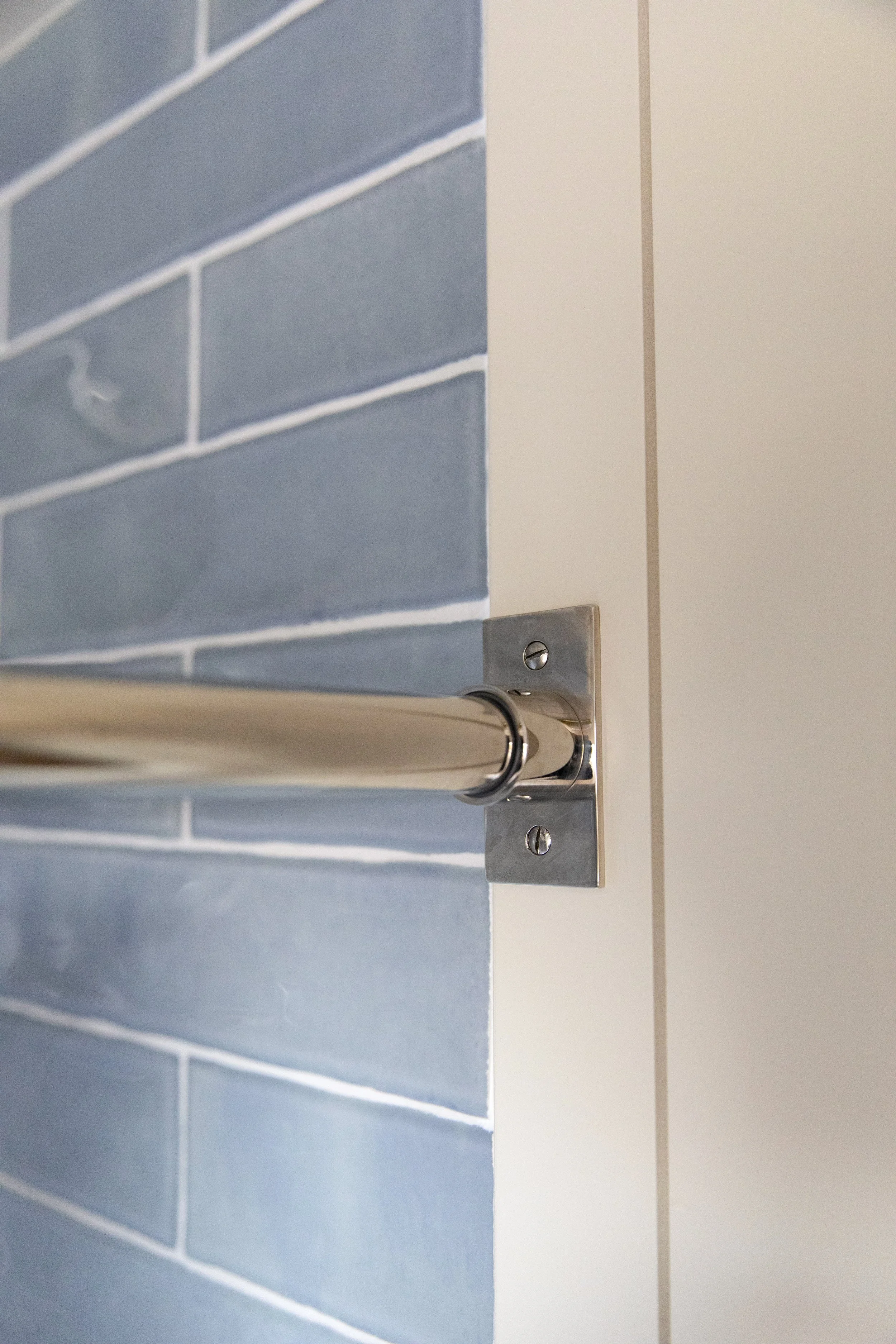 Using a brushed nickel laundry rod as a shower curtain rod (no seams!)