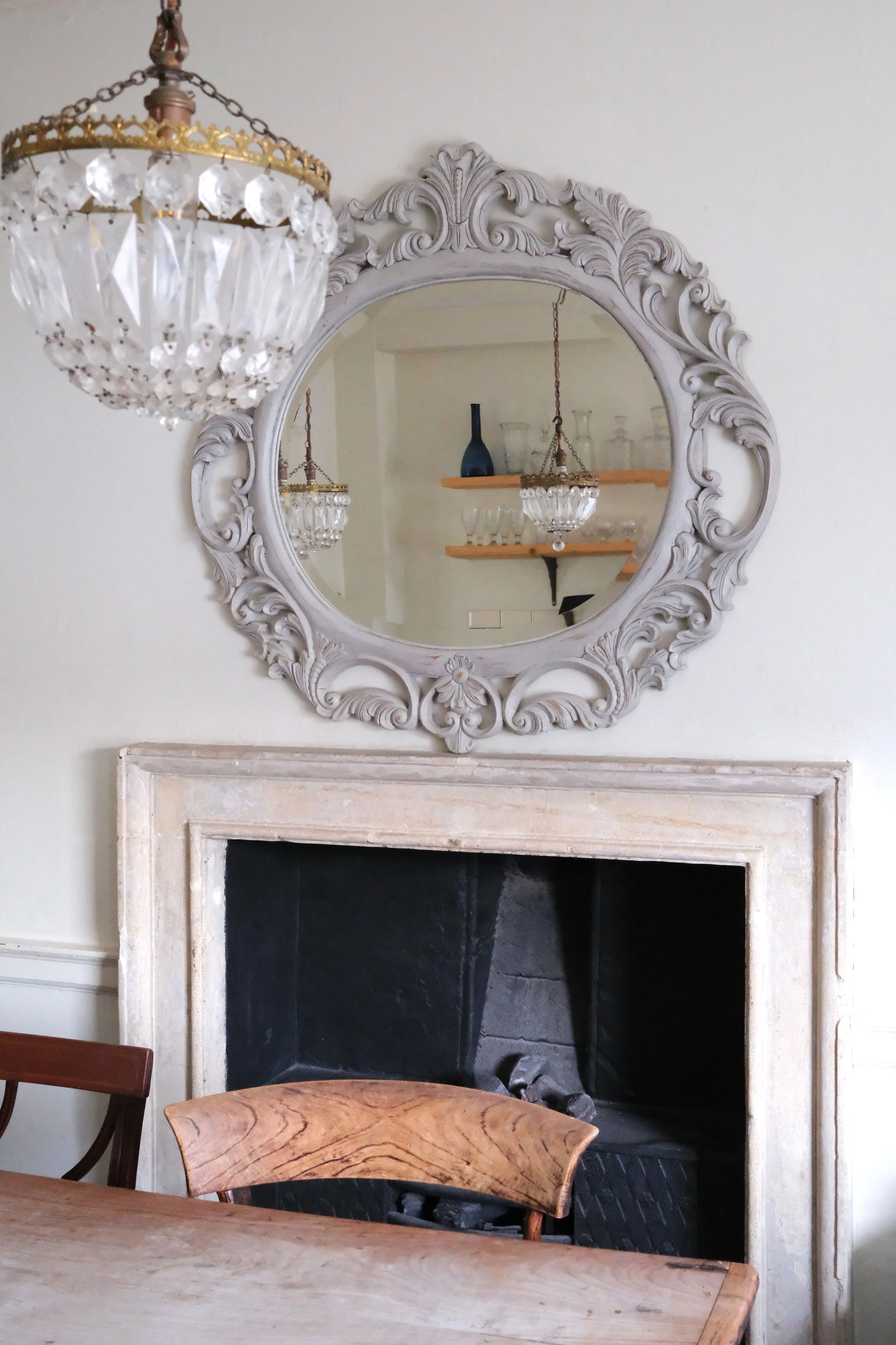 Vintage dining table and fireplace in a historic Bath apartment kitchen