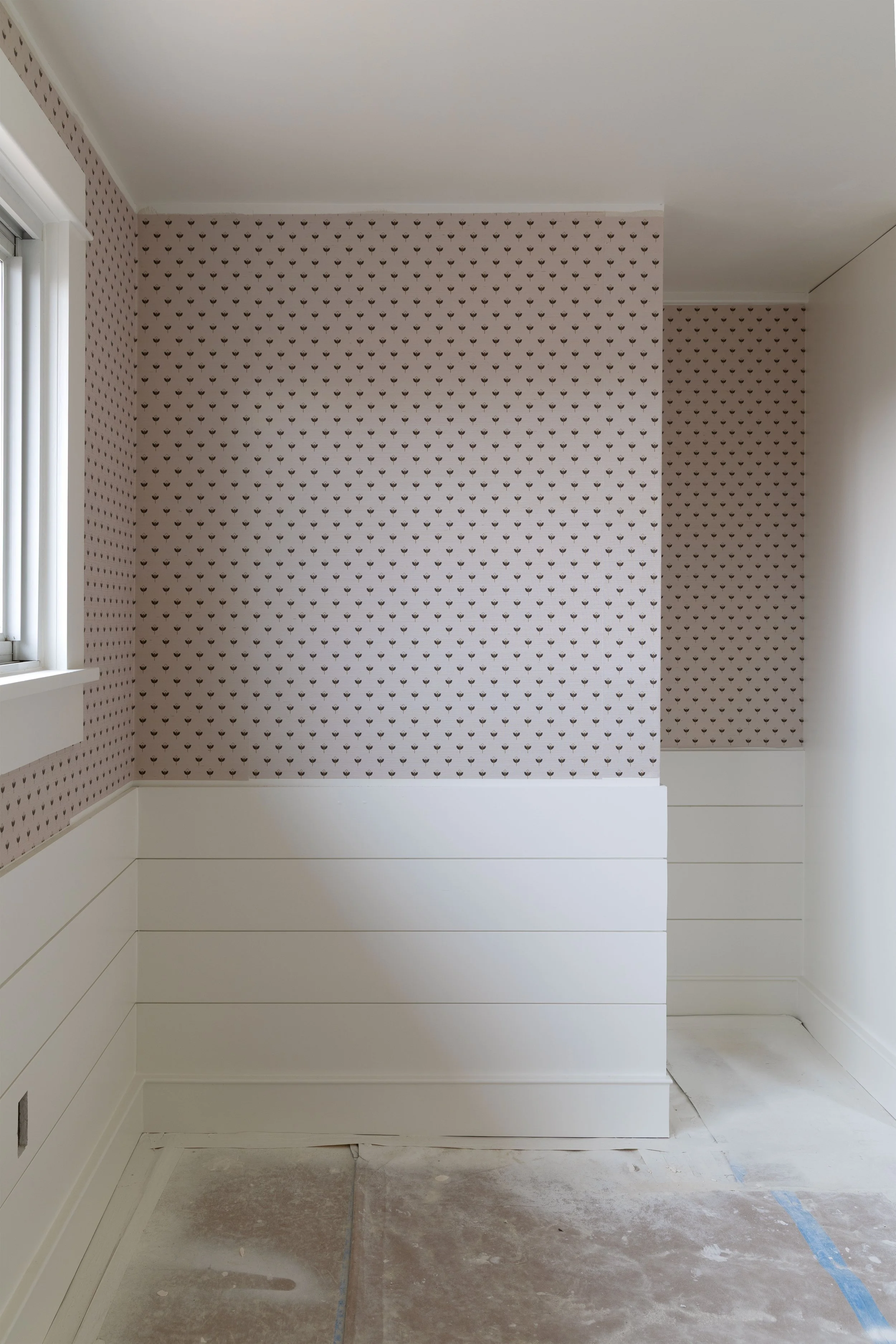 Finished grasscloth wallpaper in Daphne’s bedroom at the Hill House, showing small-scale floral print and layered texture