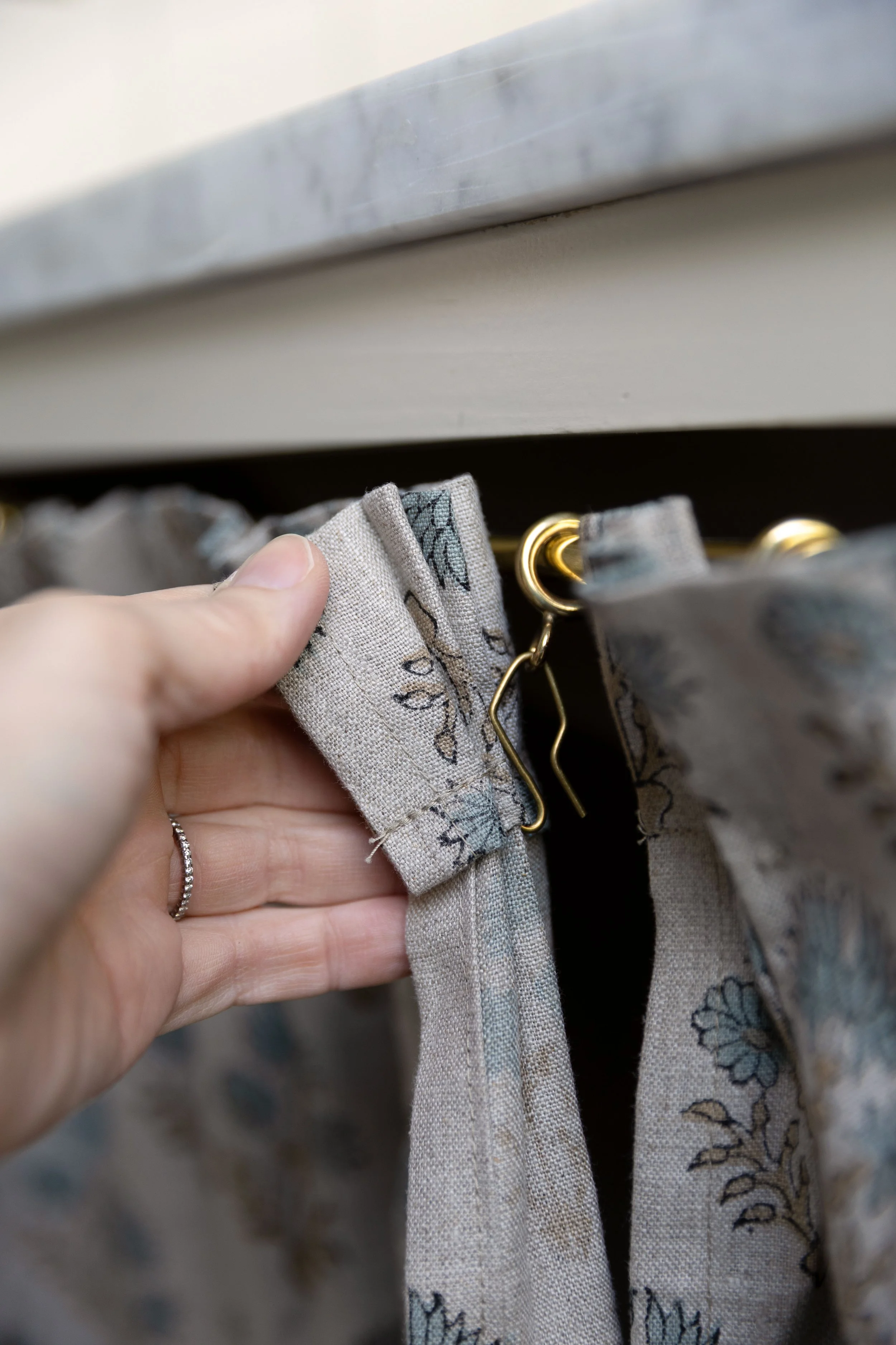 Ring and rod detail for the cabinet skirt on our Hill House bathroom vanity