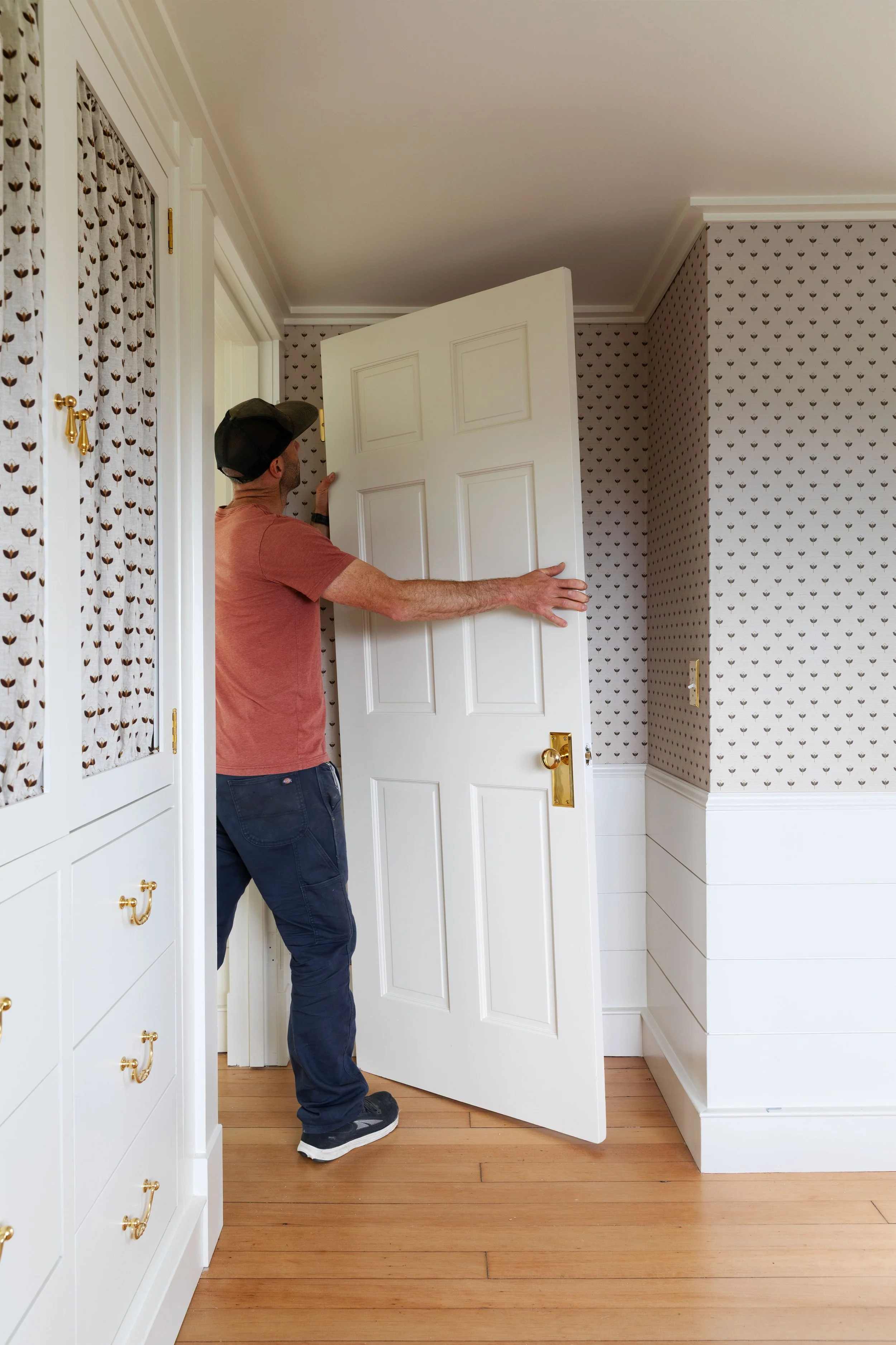 Adding vintage doors and unlaquered brass door knobs and hinges to the Hill House