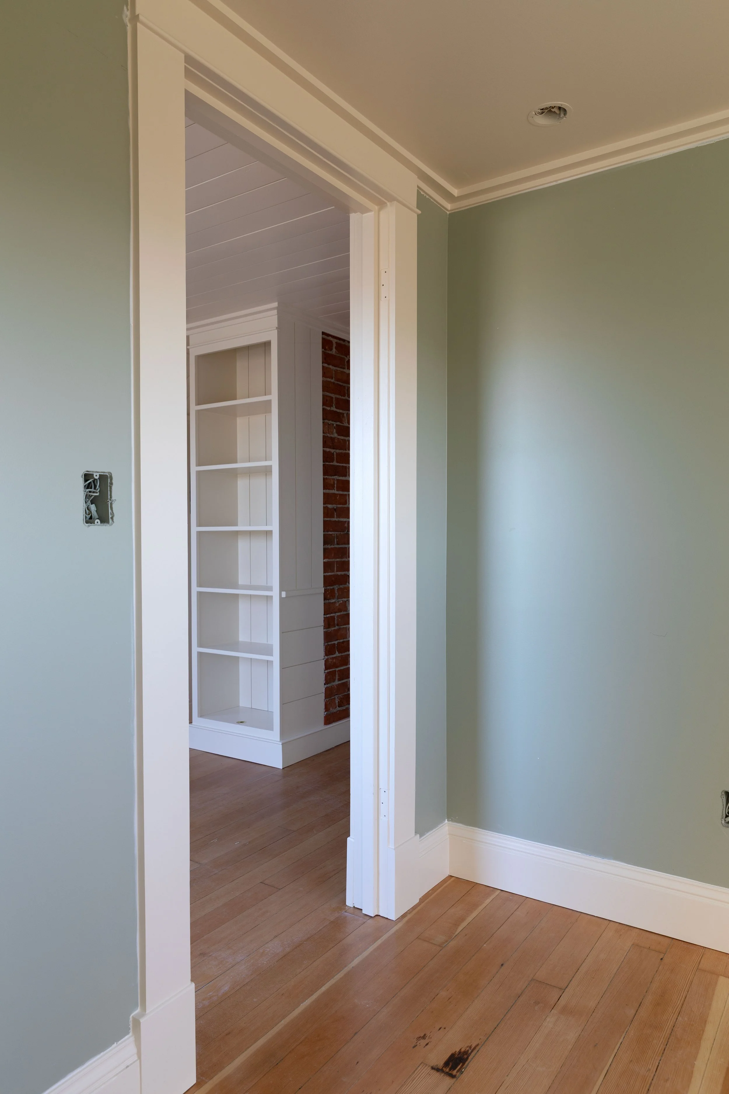 Farrow and Ball Blue Gray on walls and Slipper Satin on trim, matched by Sherwin Williams