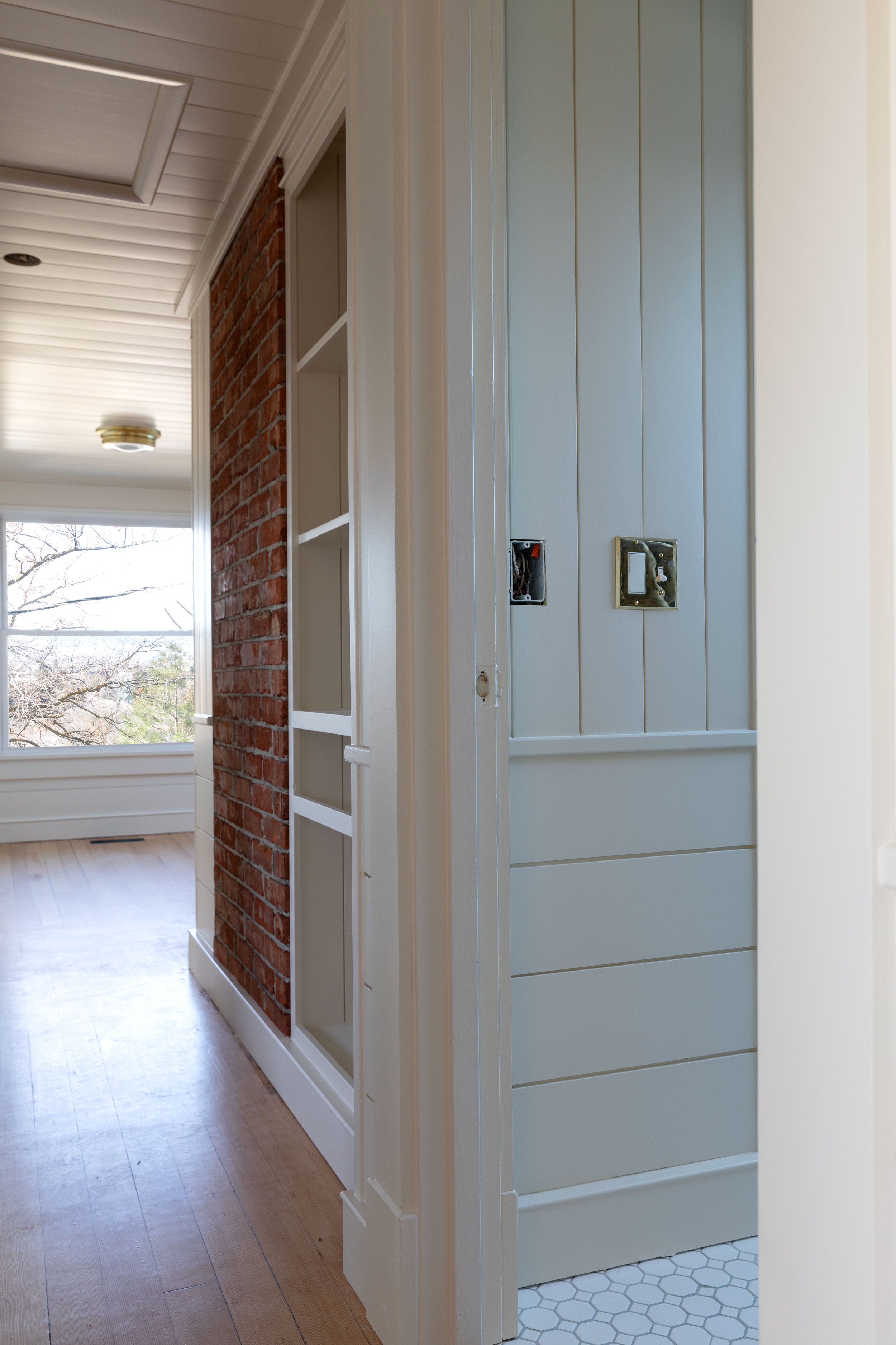 View from hallway painted Slipper Satin into bathroom painted Farrow and Ball Off White in the Hill House