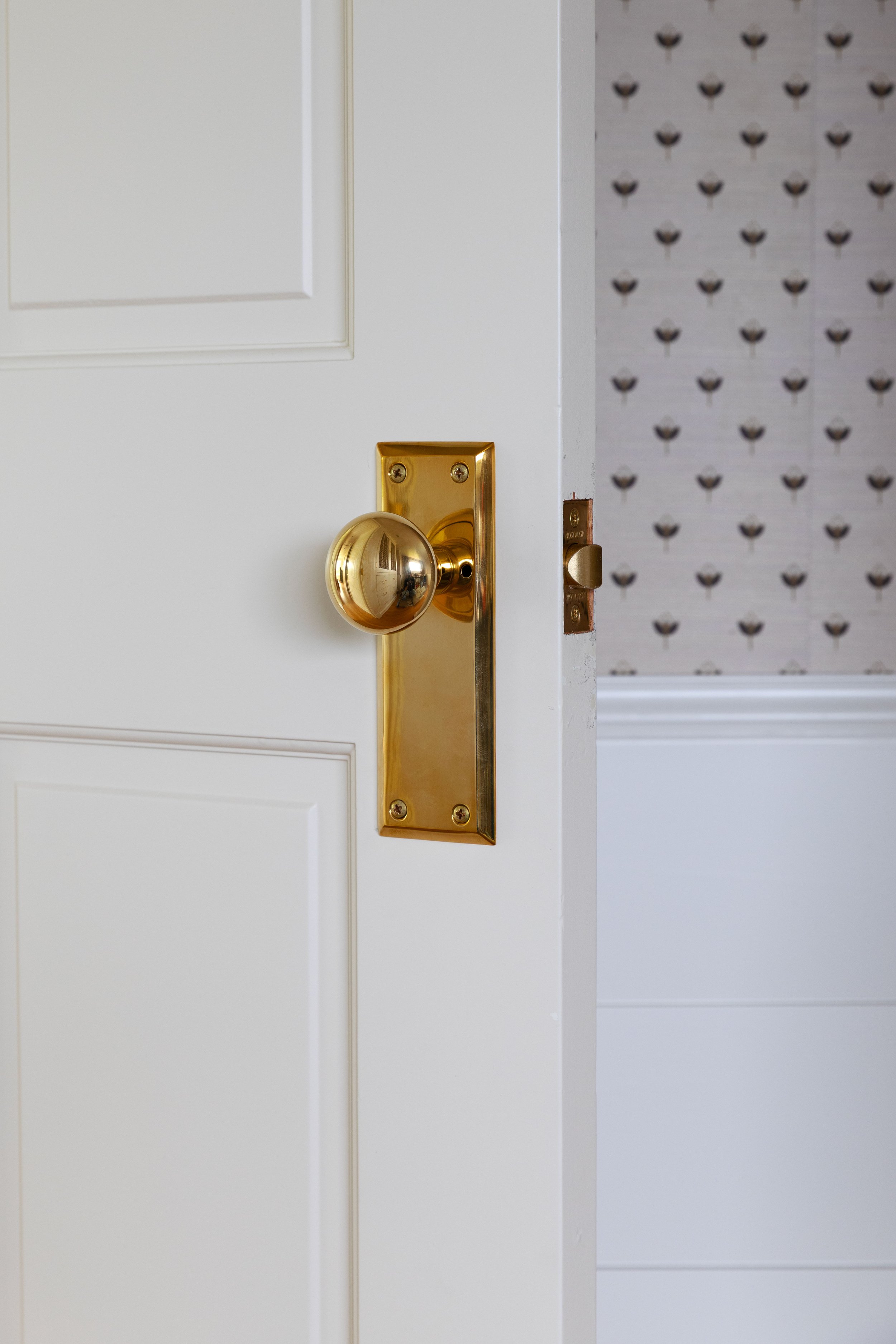 Adding new unlaquered brass door knobs with back plates to vintage doors