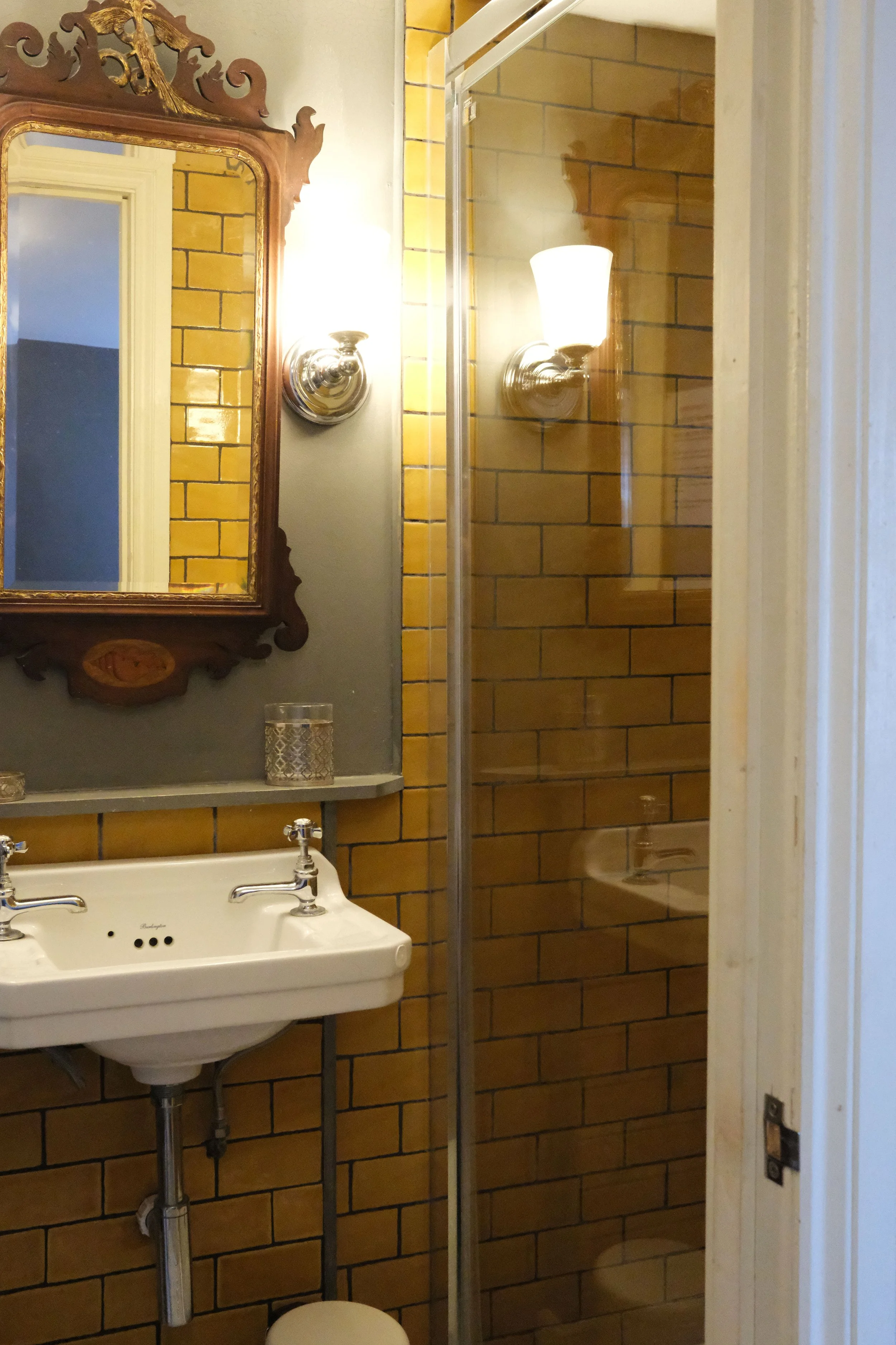 Vintage mirror in historic bathroom in Bath England