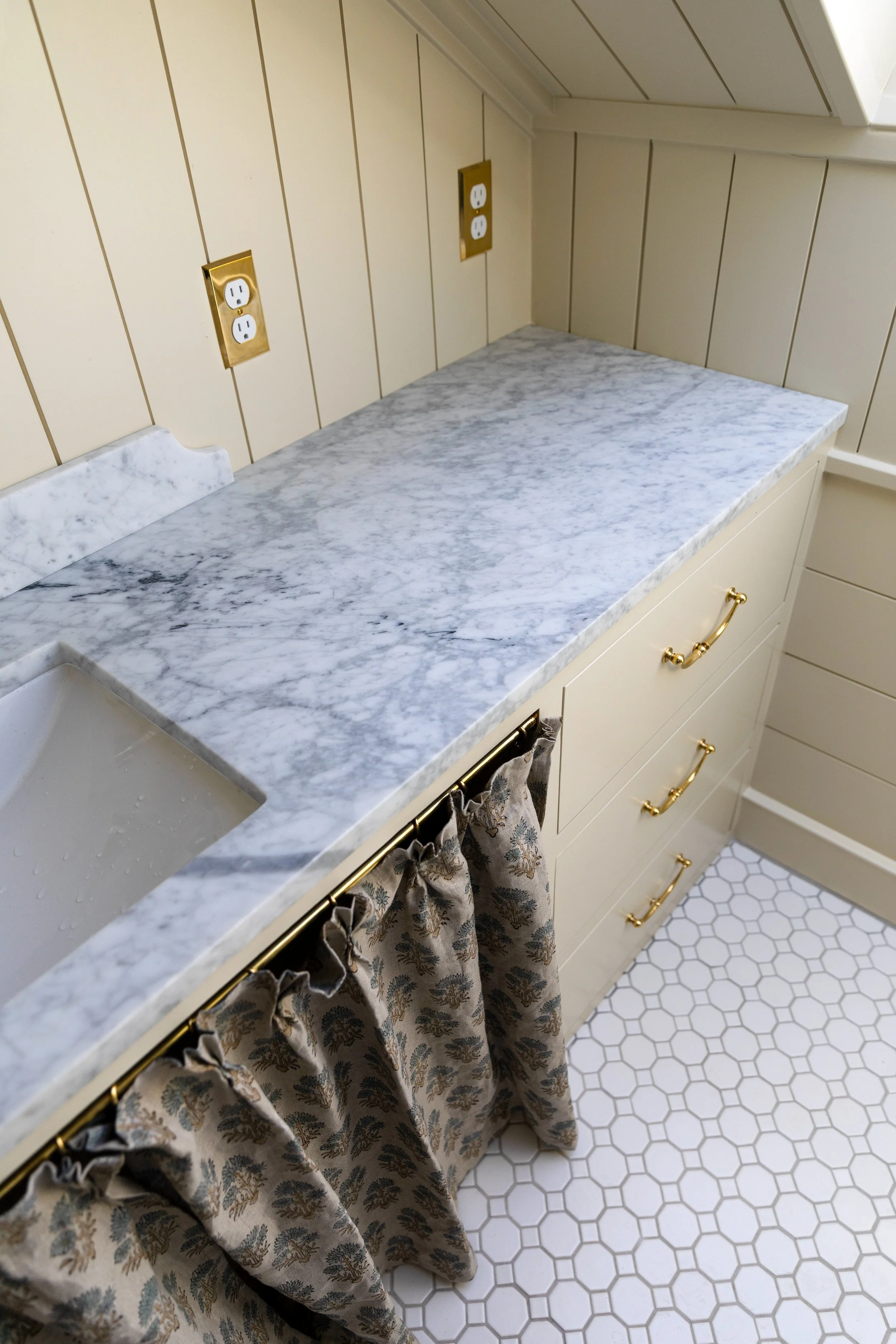Close-up of our salvaged marble bathroom countertop in the Hill House hall bath