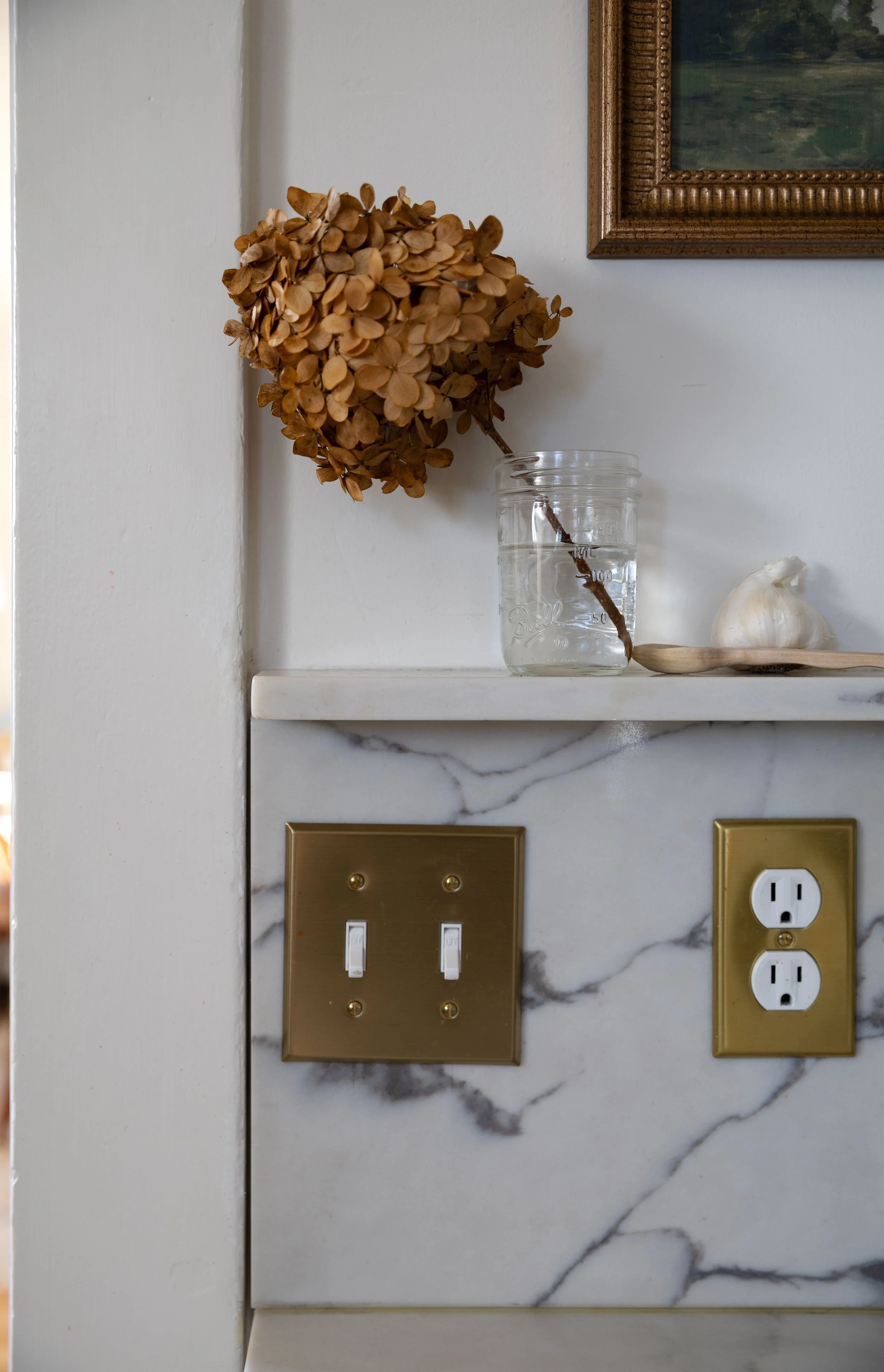 Close-up of 12-inch quartz backsplash and small shelf detail.