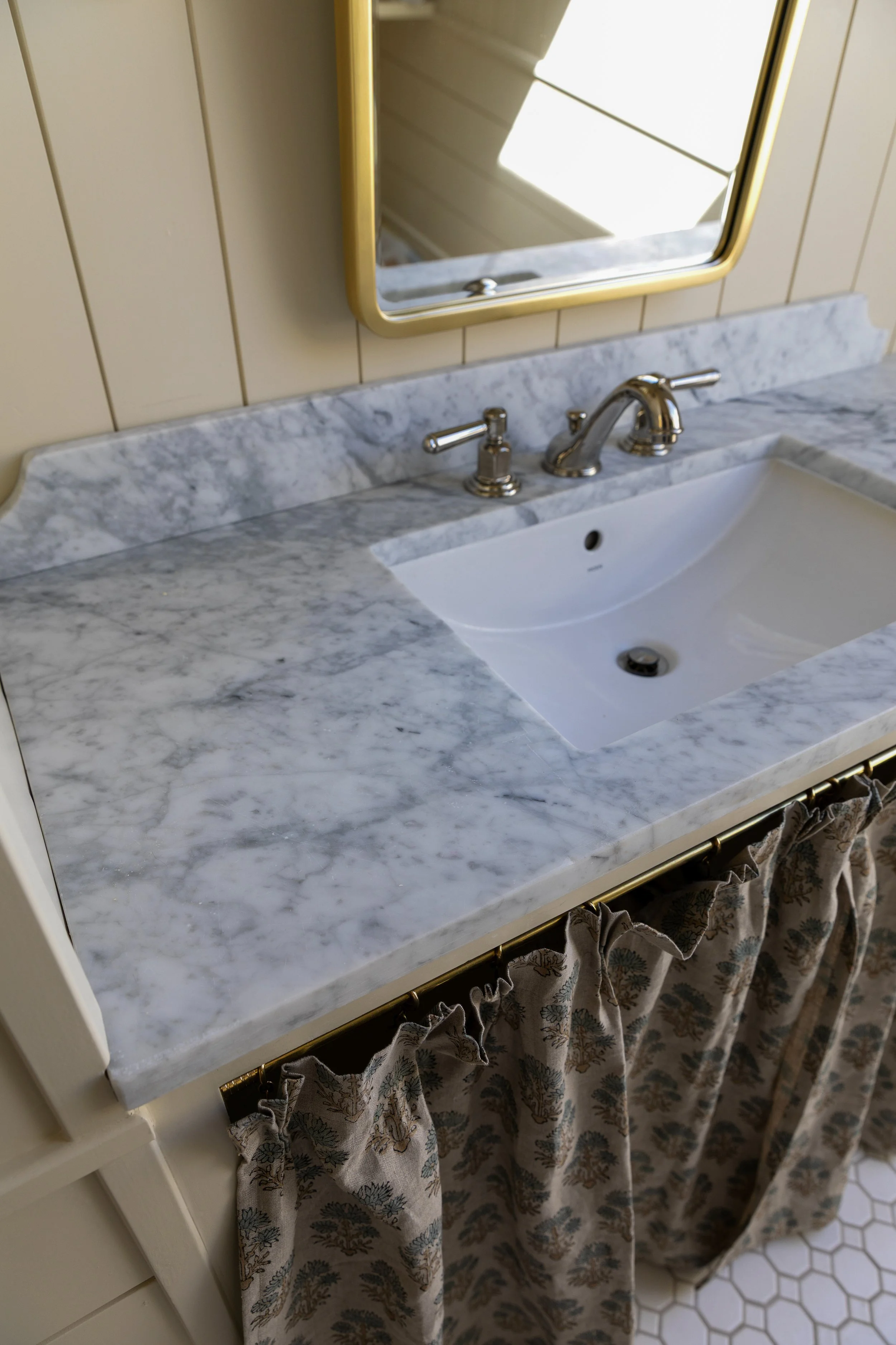 Close-up of our salvaged marble bathroom countertop in the Hill House hall bath