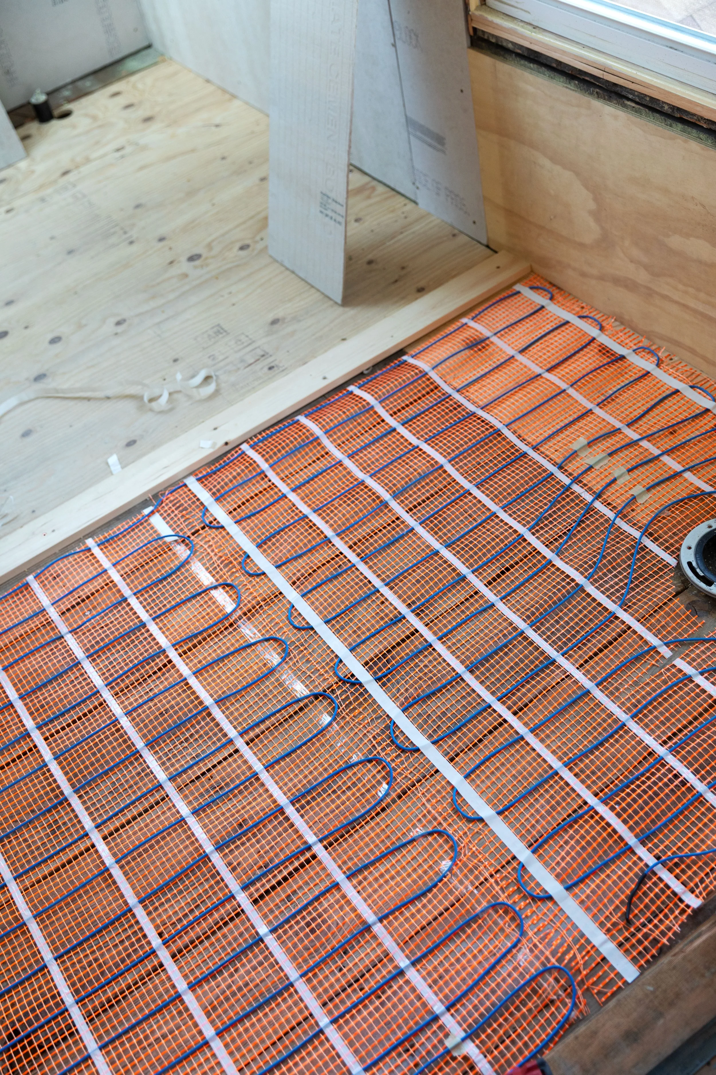 How we installed heated floors in our upstairs bathroom at the Hill House