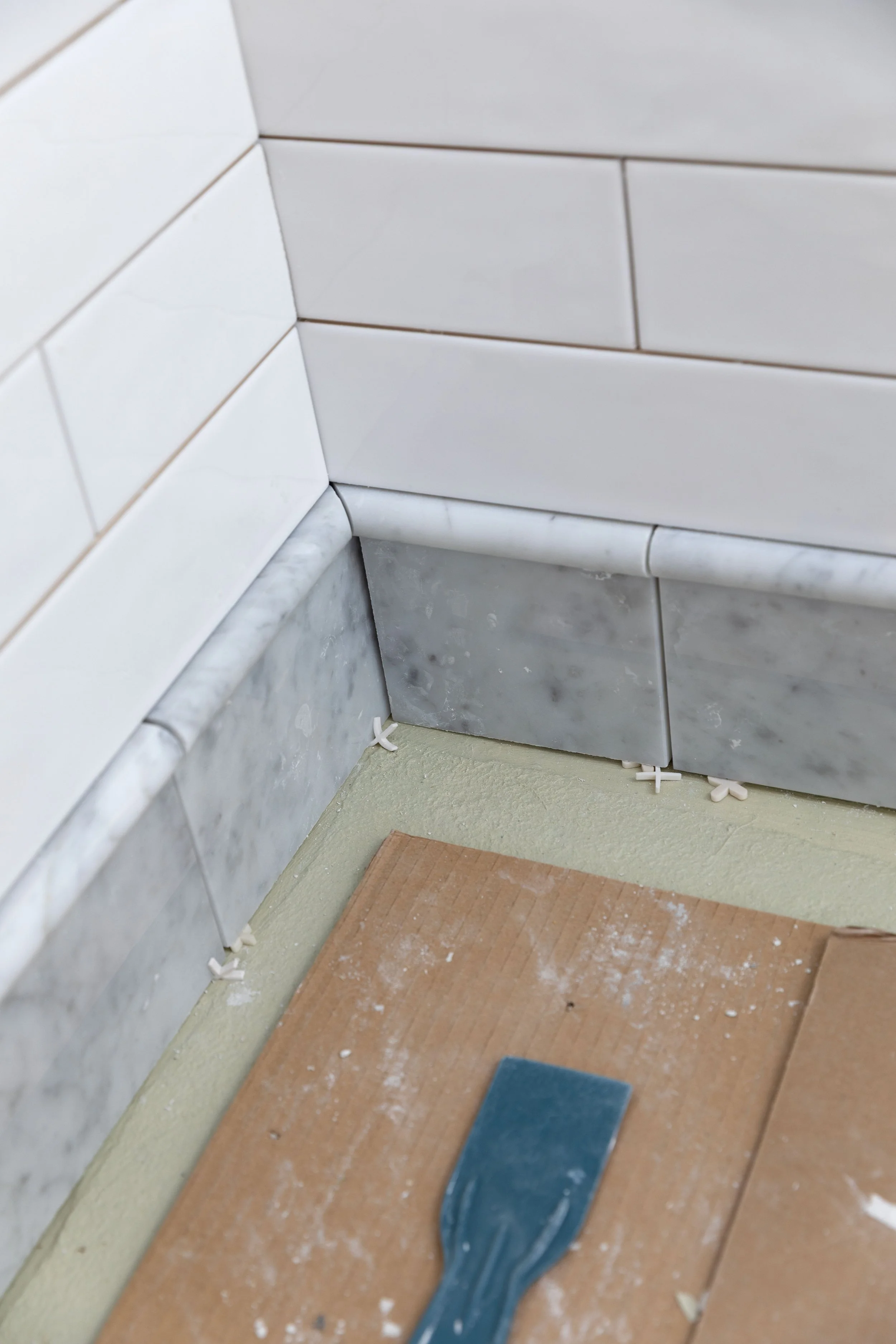 Close up of marble base tile and pencil detail