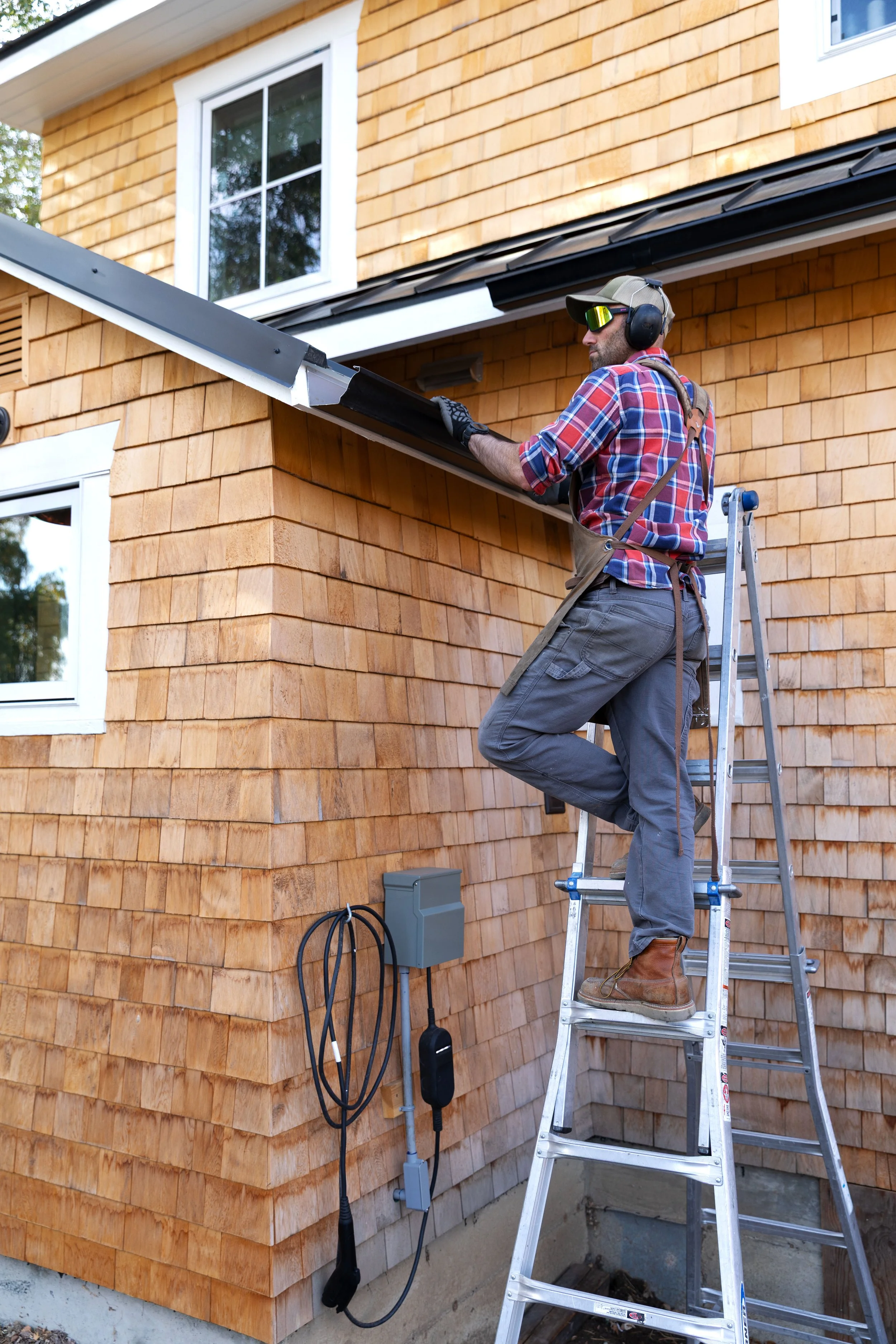 Simple black K-style gutters on cedar shake siding — weekend DIY home upgrade