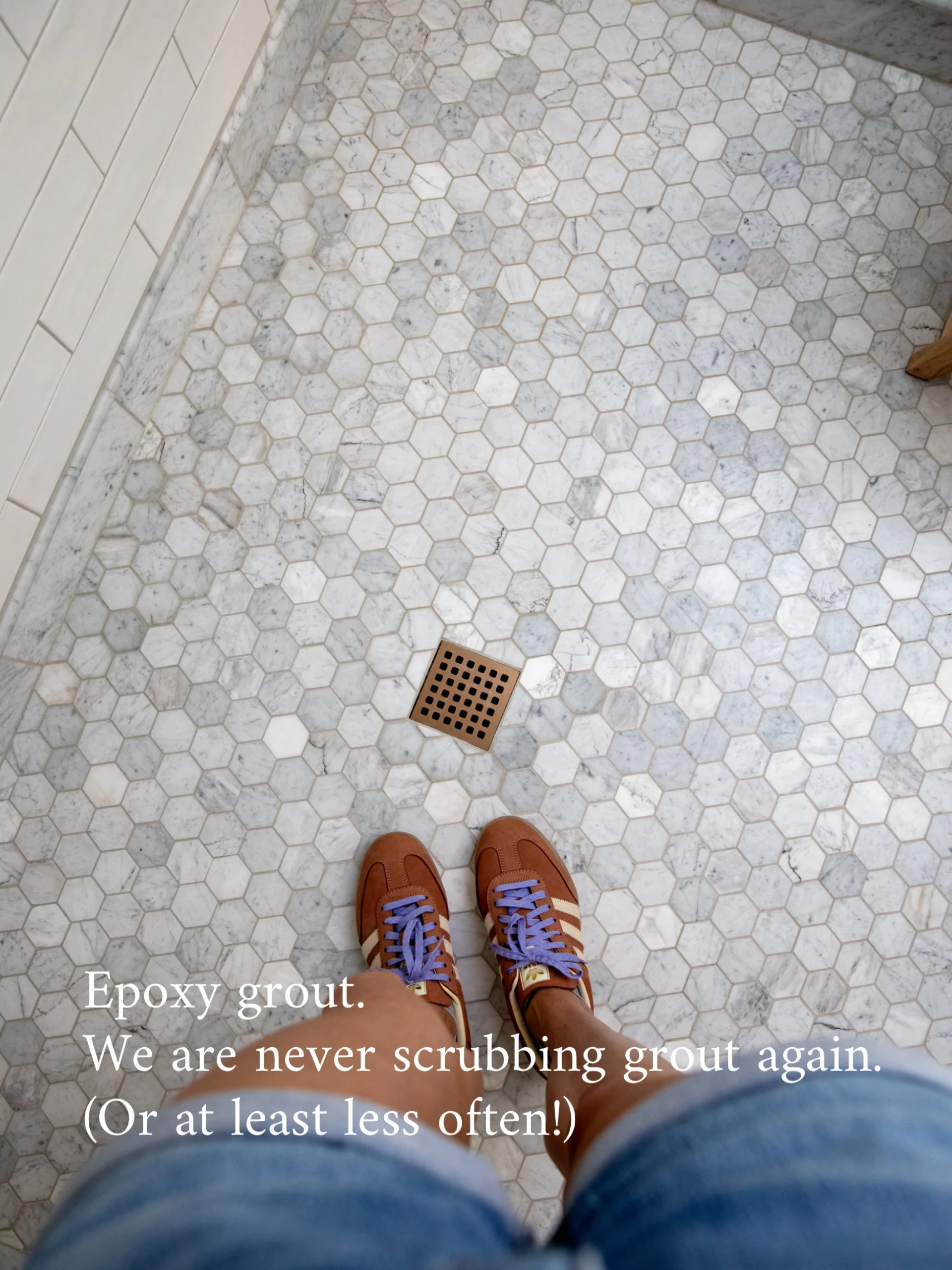 Marble hex bathroom floor with iron-colored epoxy grout in the Hill House ensuite
