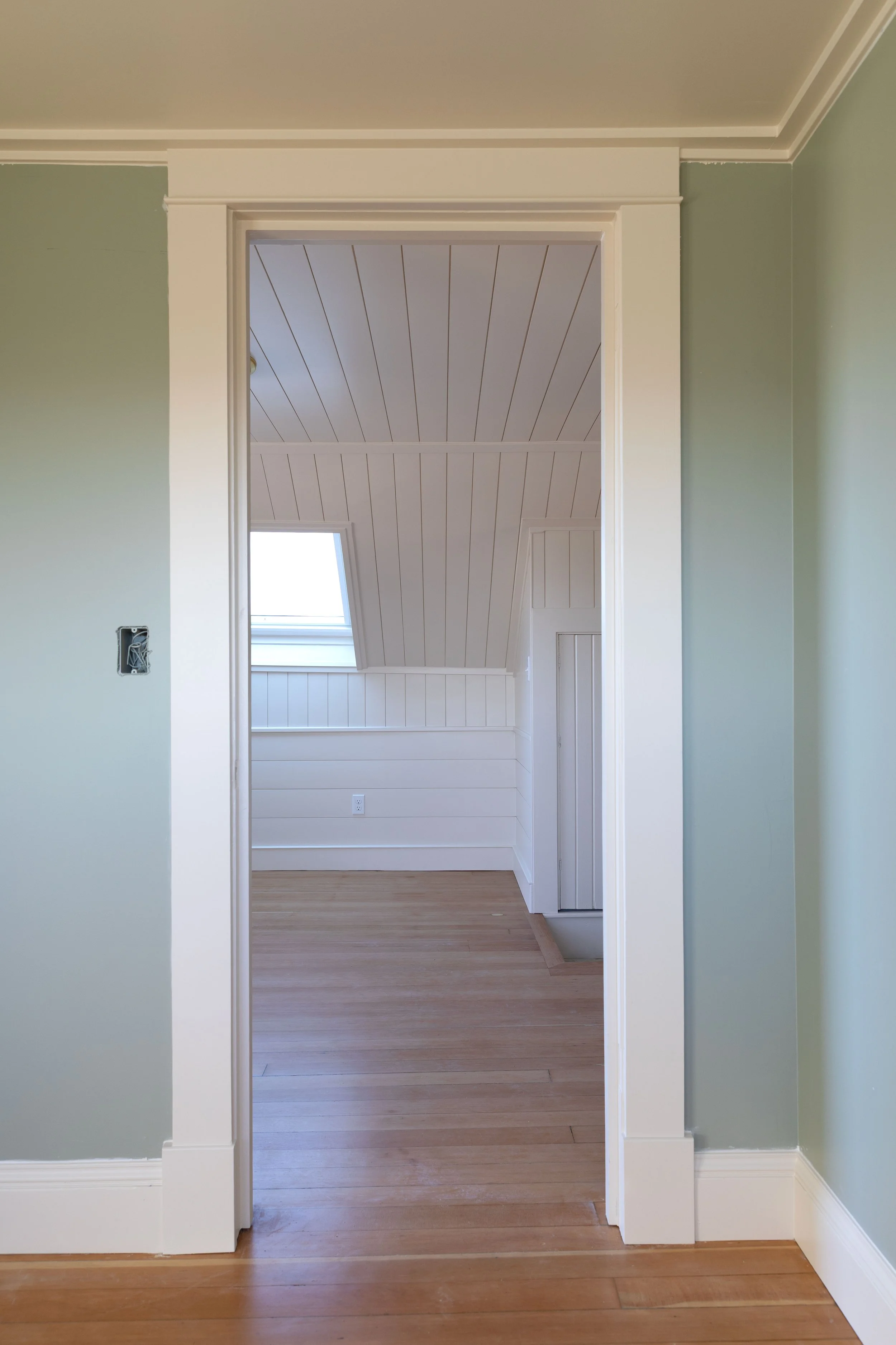 The blue gray bedroom in the Hill House and paneled snug beyond