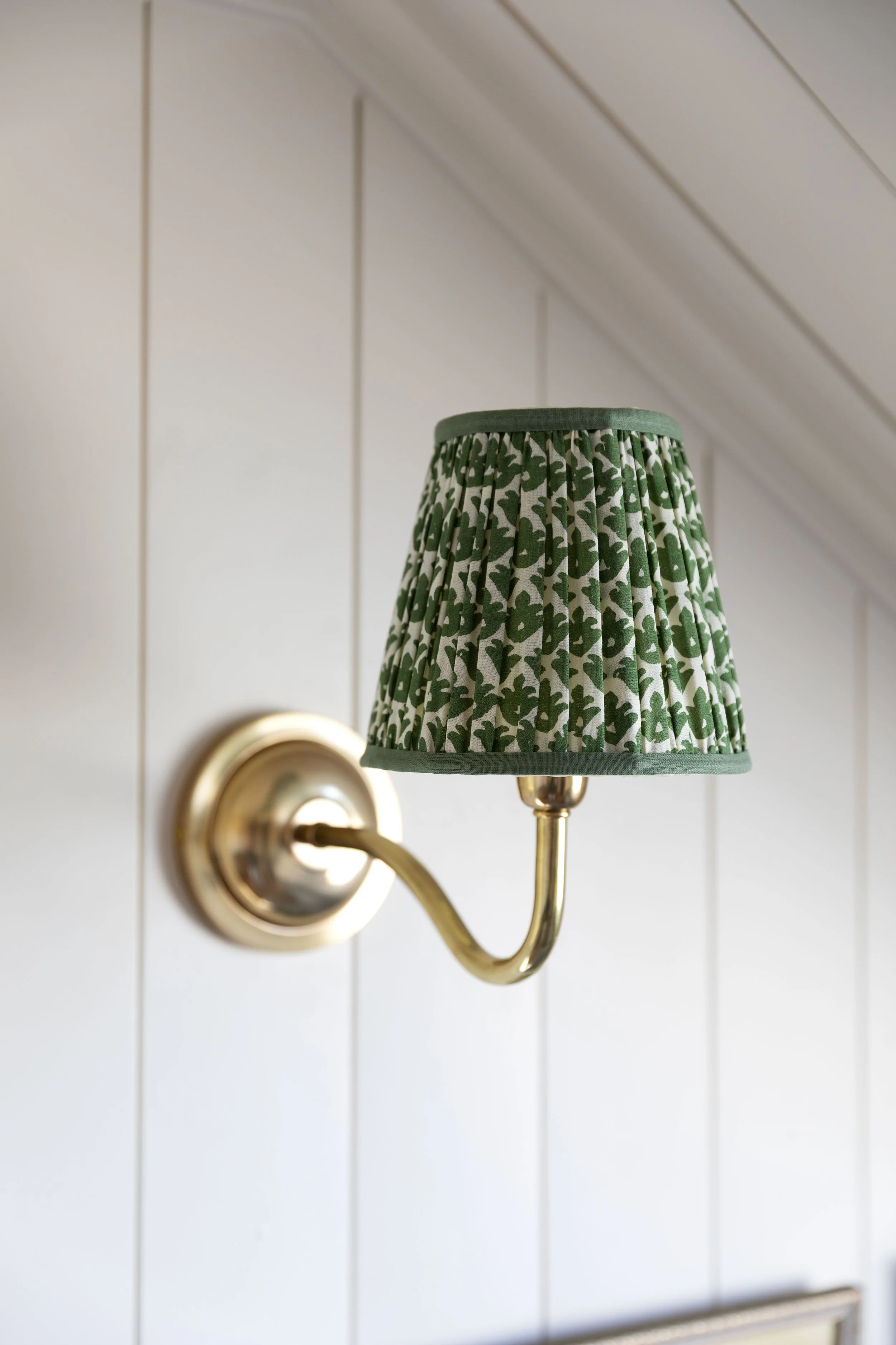 Lighting ideas for a low ceiling living room with flush mount and wall sconces