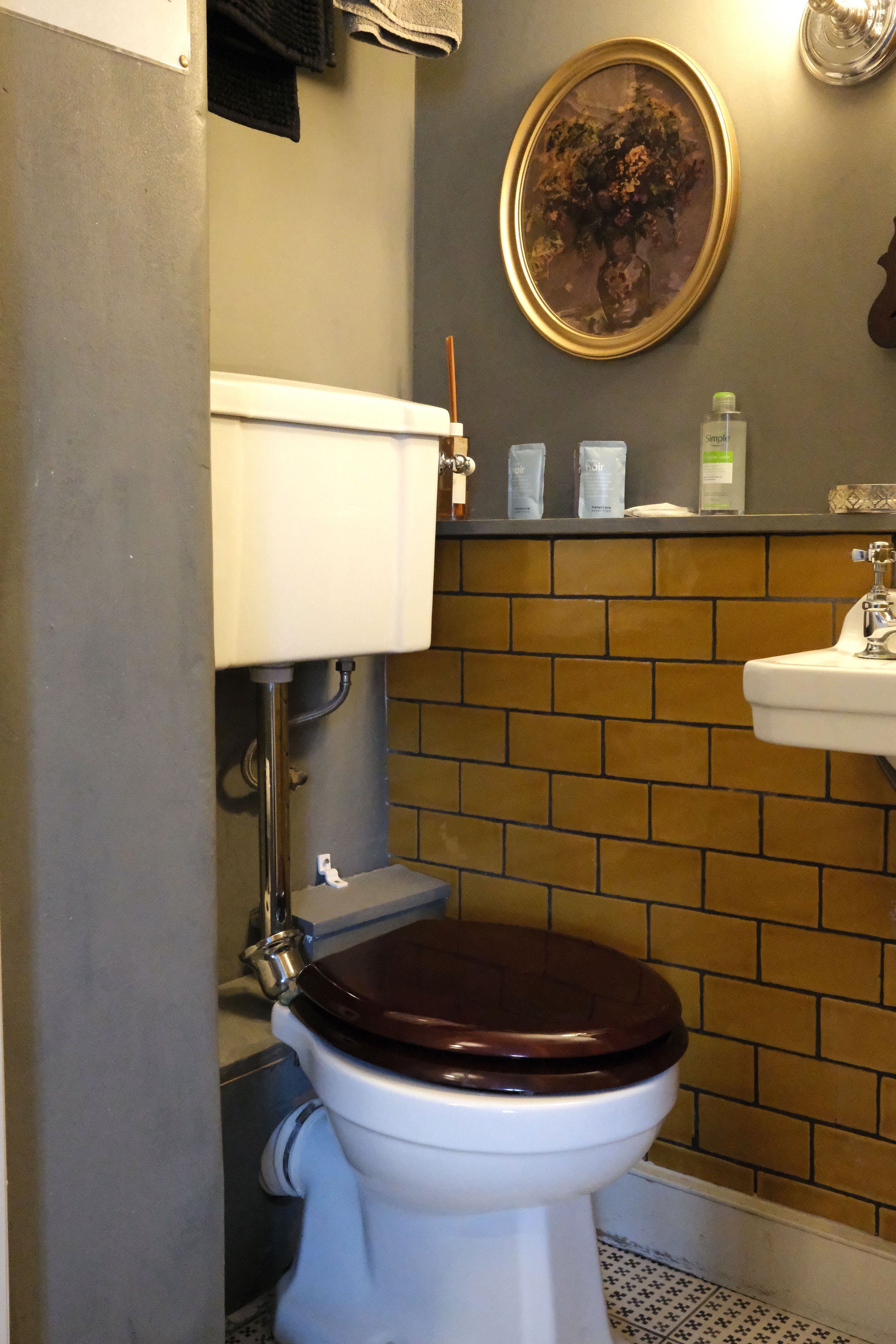 Soft gray and colorful tiles in a small bathroom in Bath England