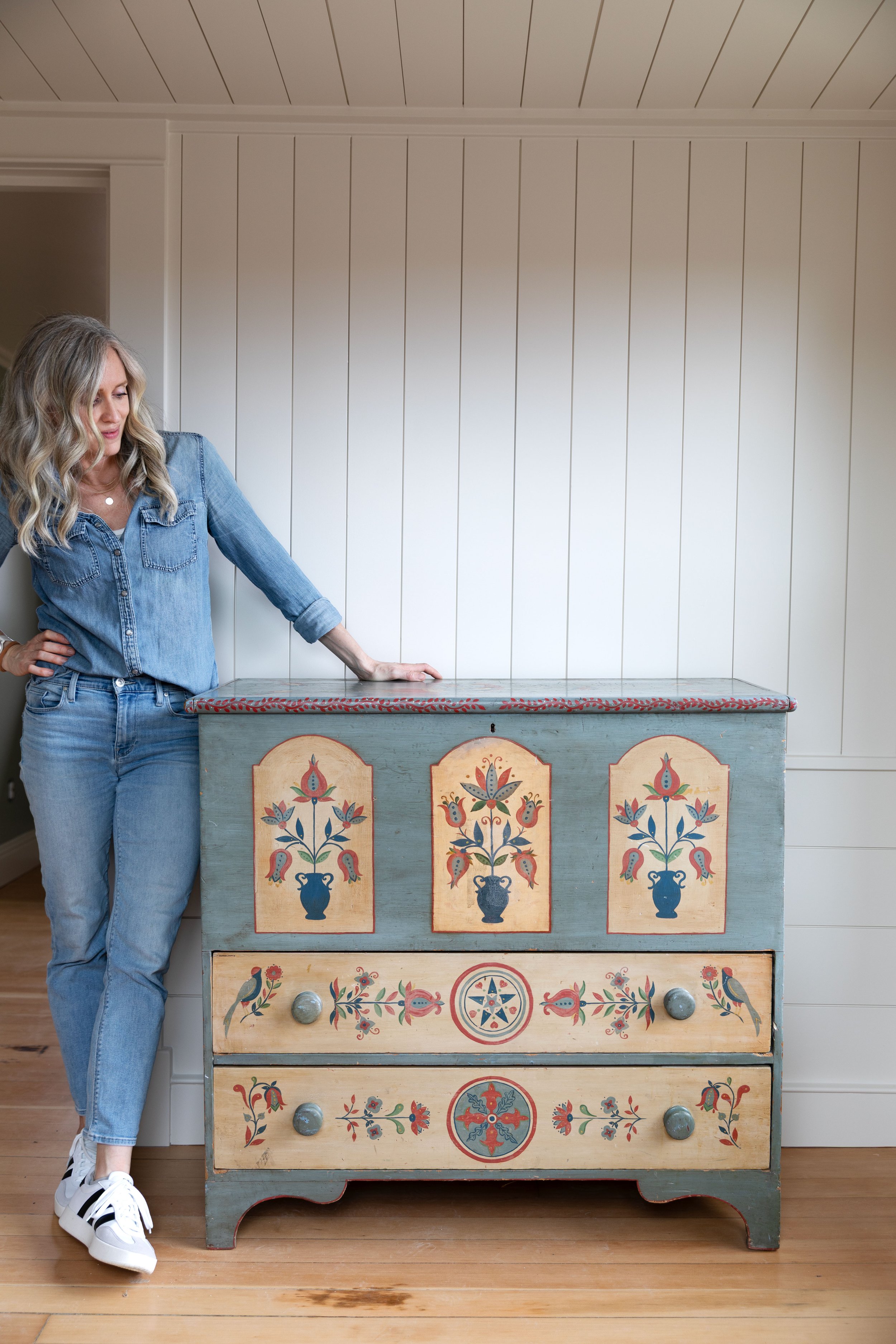 A hand-painted dresser for the Hill House upstairs landing with paneled walls and fir floors