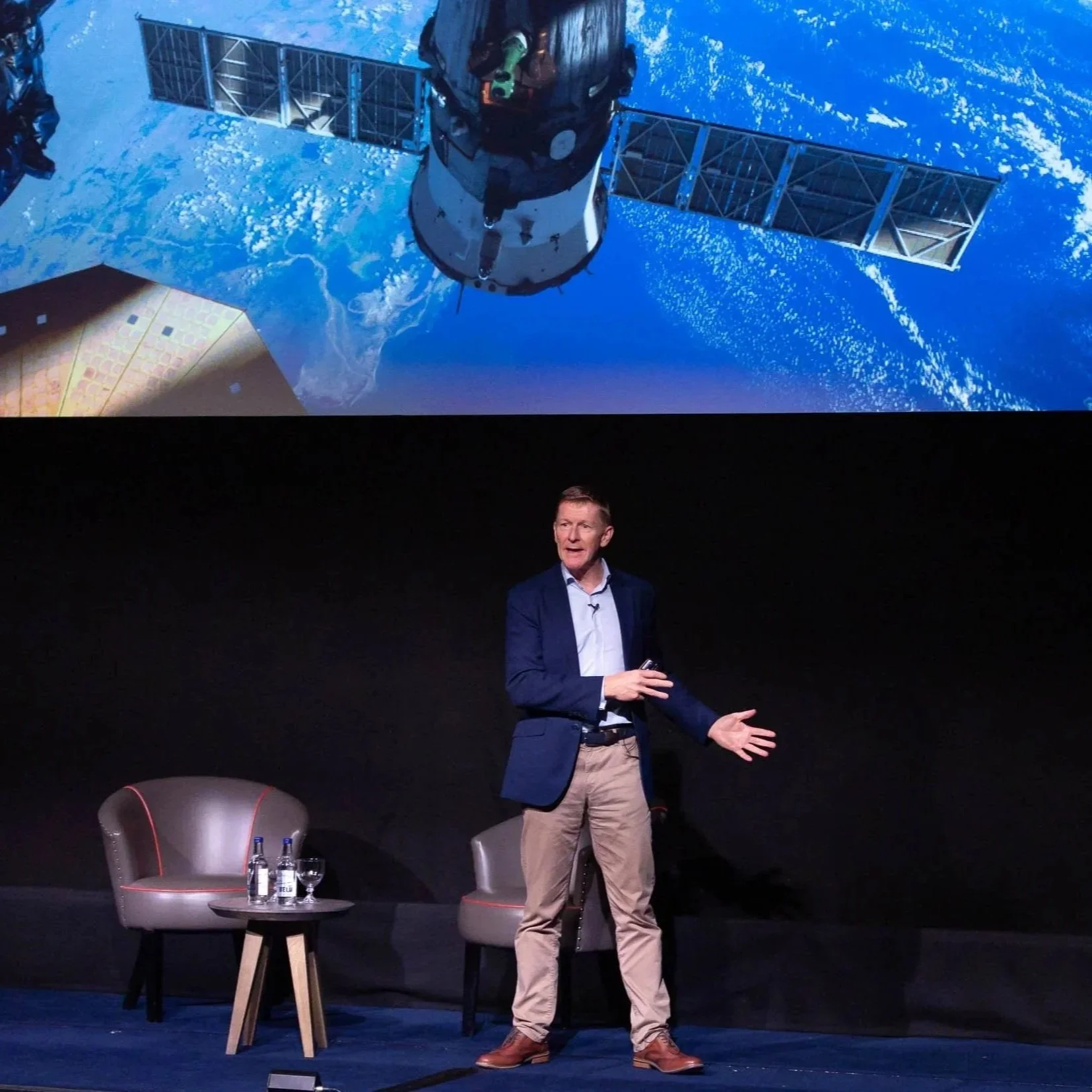 Professional event photography at London business conference showing astronaut Tim Peake on stage