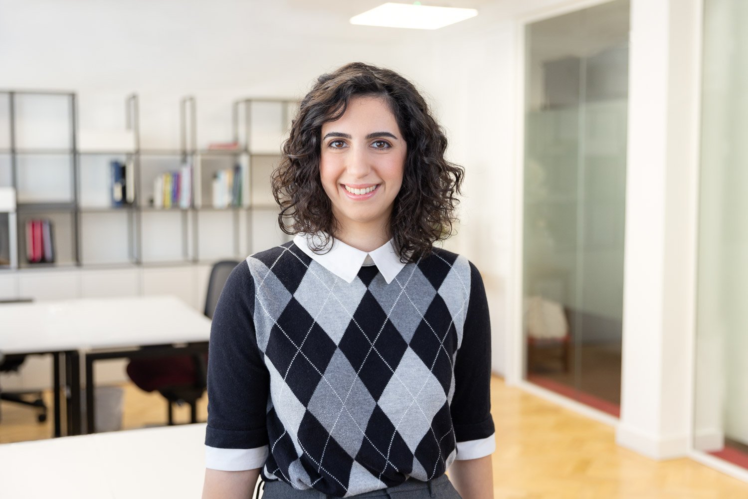 Female employee in office location during a corporate team headshot photoshoot on location in London 