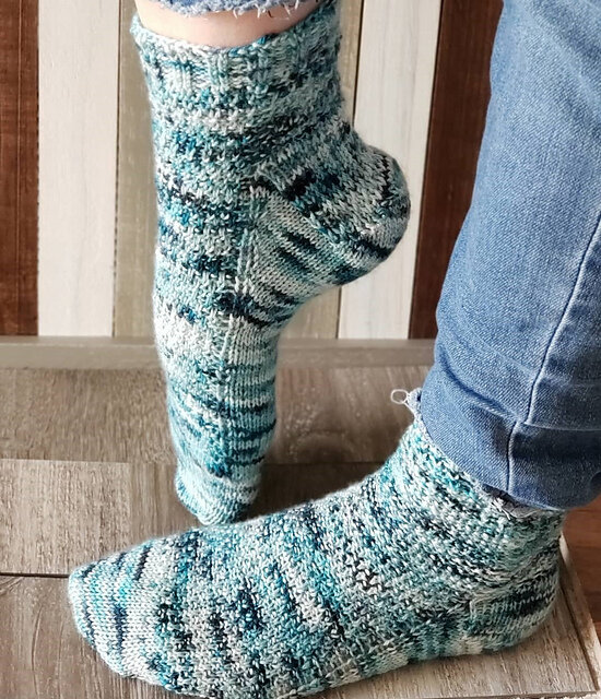 Pebbles on the beach socks by Jan Yuill