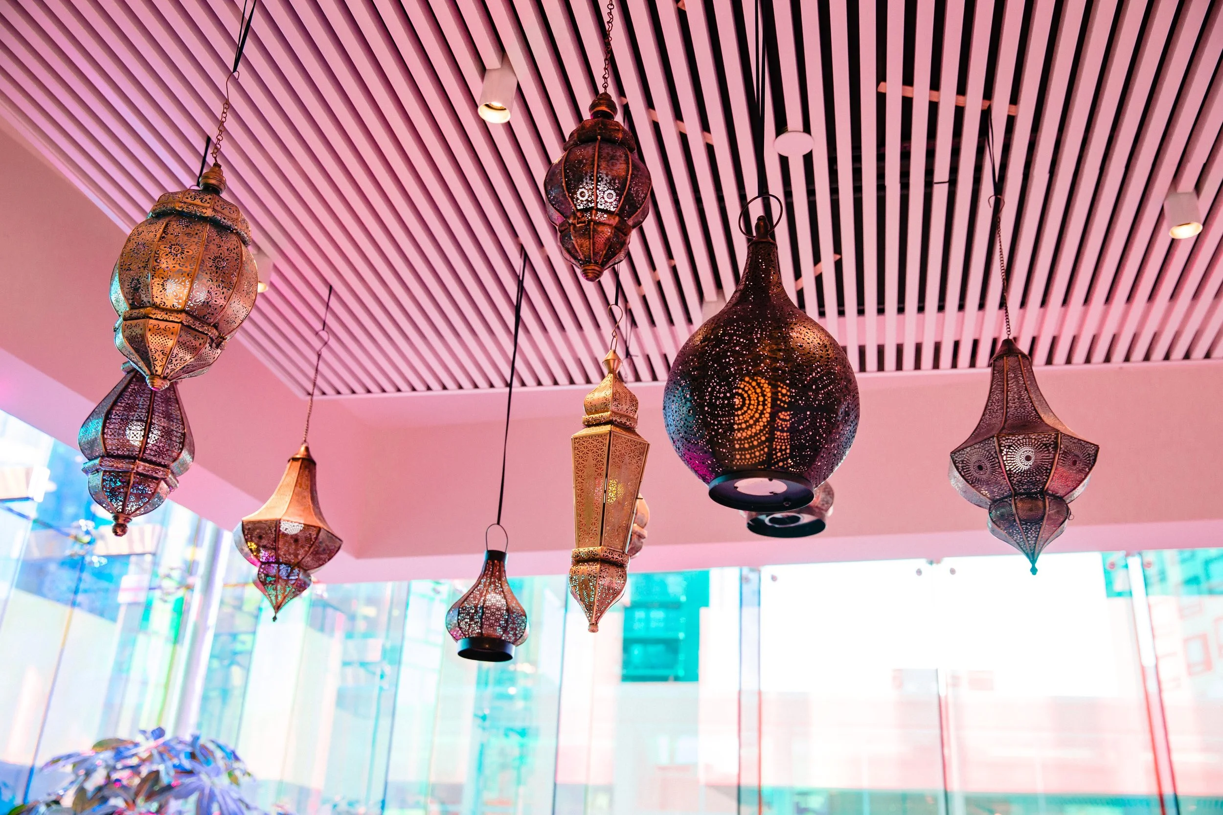 Hanging mixed metal moroccon lanterns at an Indian & Nigerian wedding